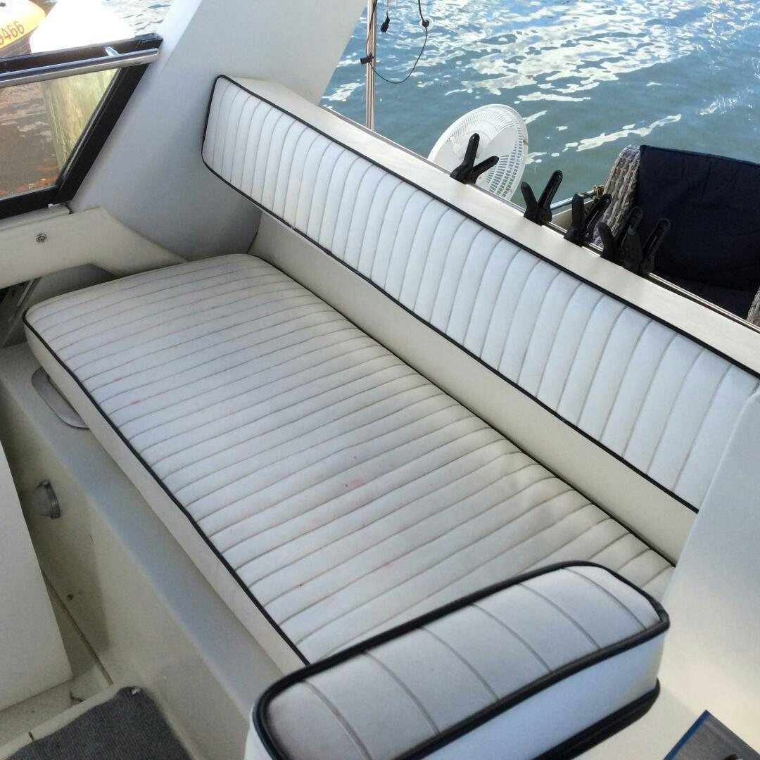 a white boat with a white cover aboard TREES HOUSE Yacht for Sale