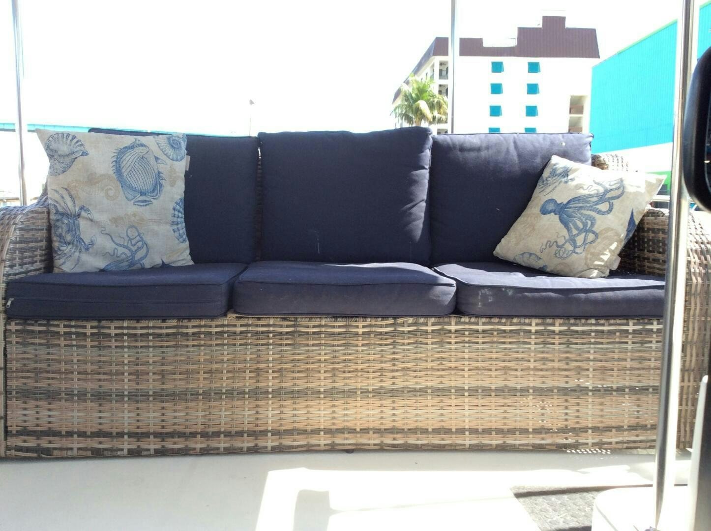 a couch with pillows aboard TREES HOUSE Yacht for Sale