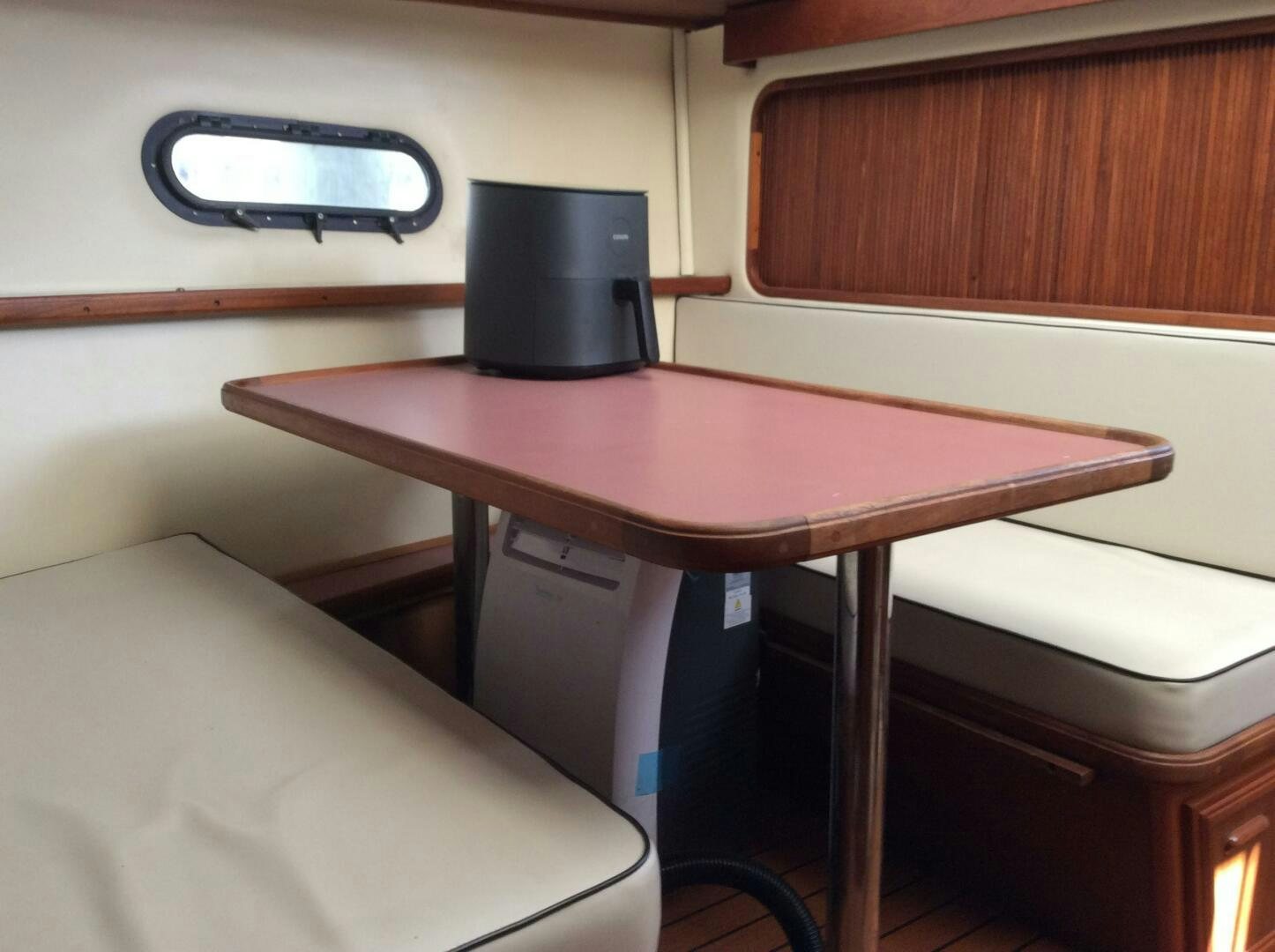 a desk with a chair and a lamp on it aboard TREES HOUSE Yacht for Sale