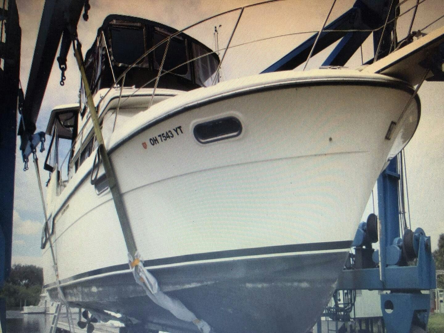 a white boat with a black and white sail aboard TREES HOUSE Yacht for Sale