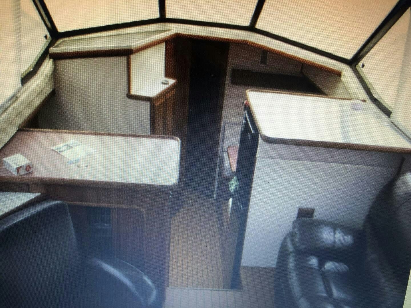 a room with a desk and chairs aboard TREES HOUSE Yacht for Sale