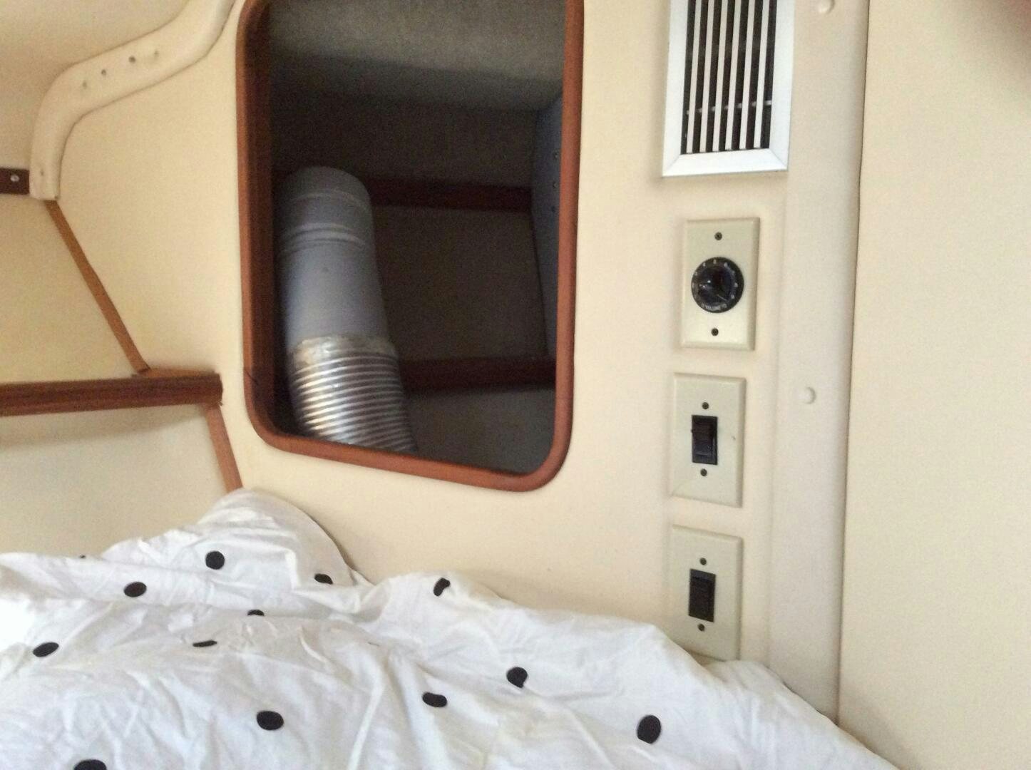 a white wall with a black speaker aboard TREES HOUSE Yacht for Sale