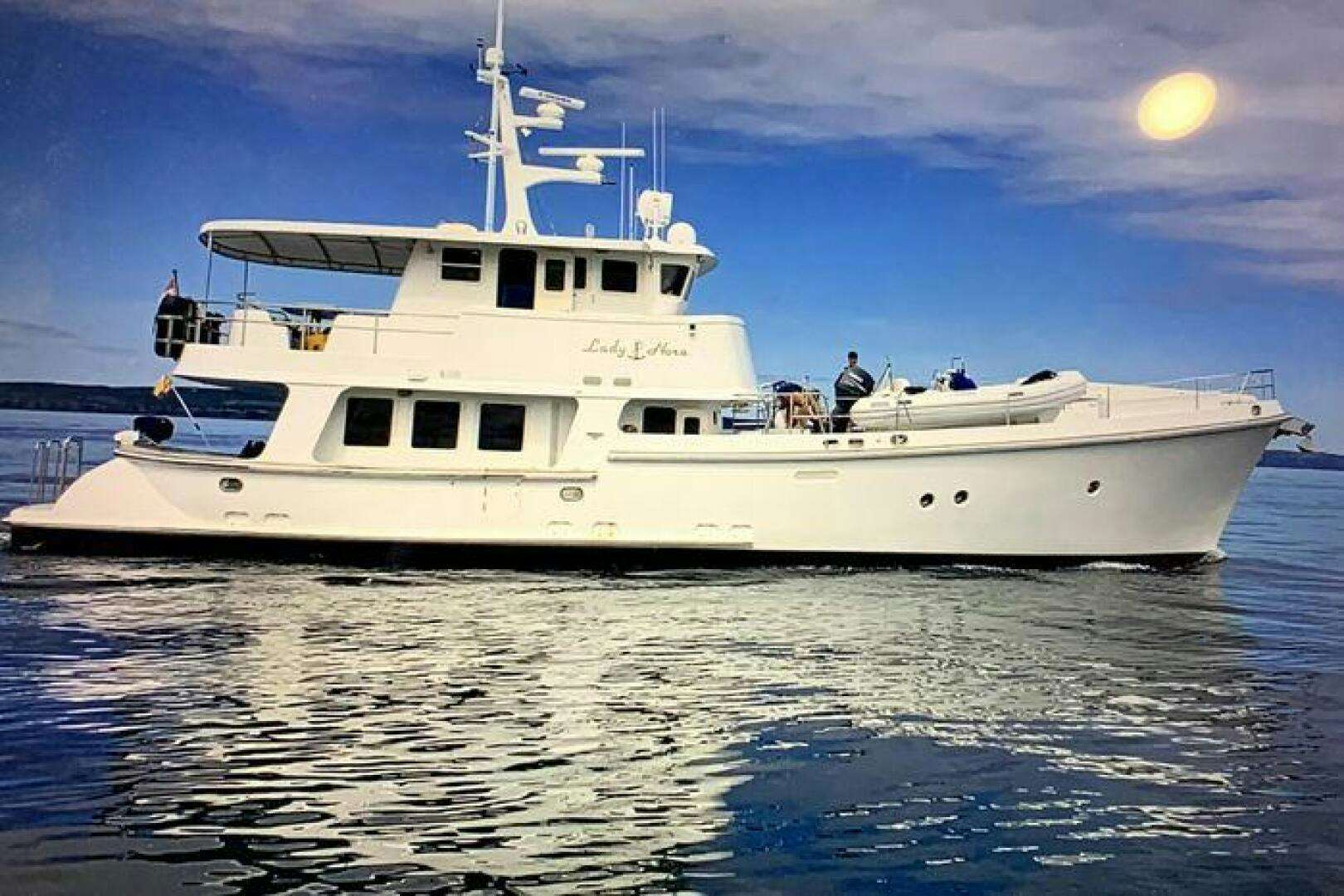 a white boat in the water aboard LADY NORA II Yacht for Sale