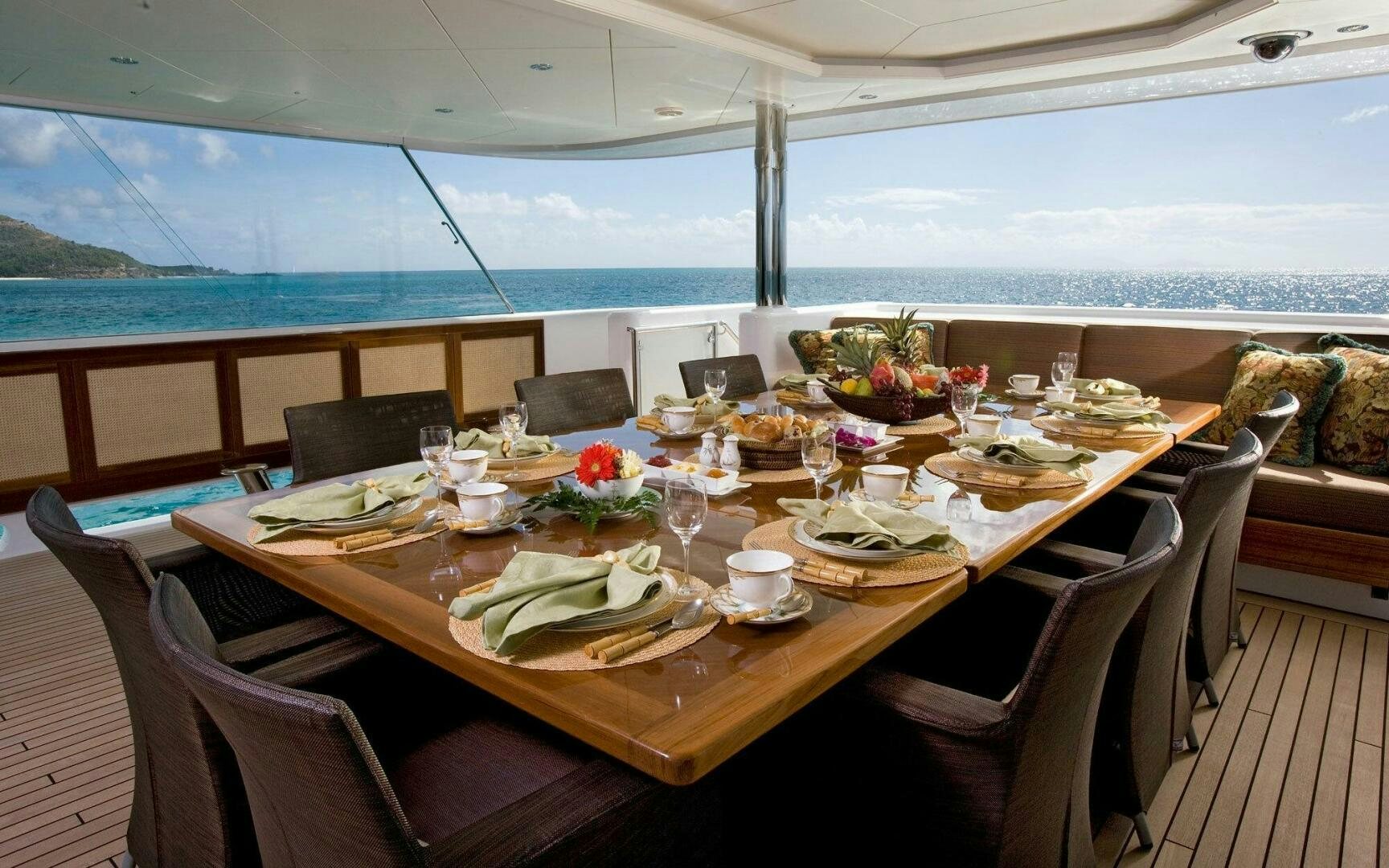 a table set for a meal aboard PERLE BLEUE Yacht for Sale