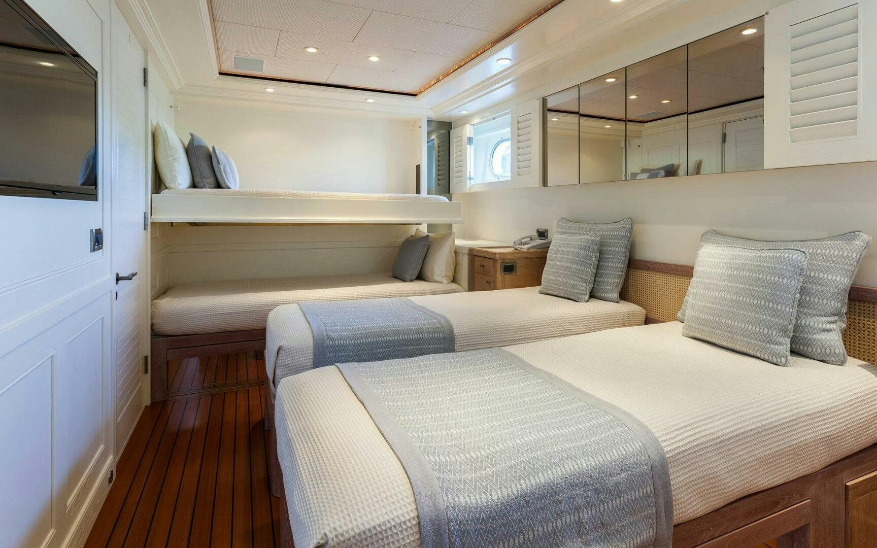 a room with two beds aboard PERLE BLEUE Yacht for Sale