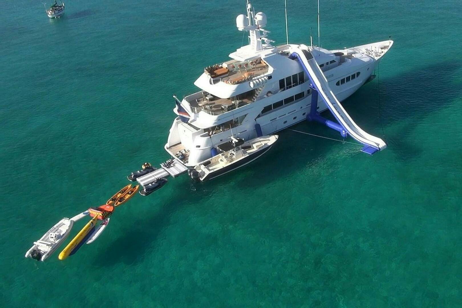a helicopter flying over a boat aboard PERLE BLEUE Yacht for Sale