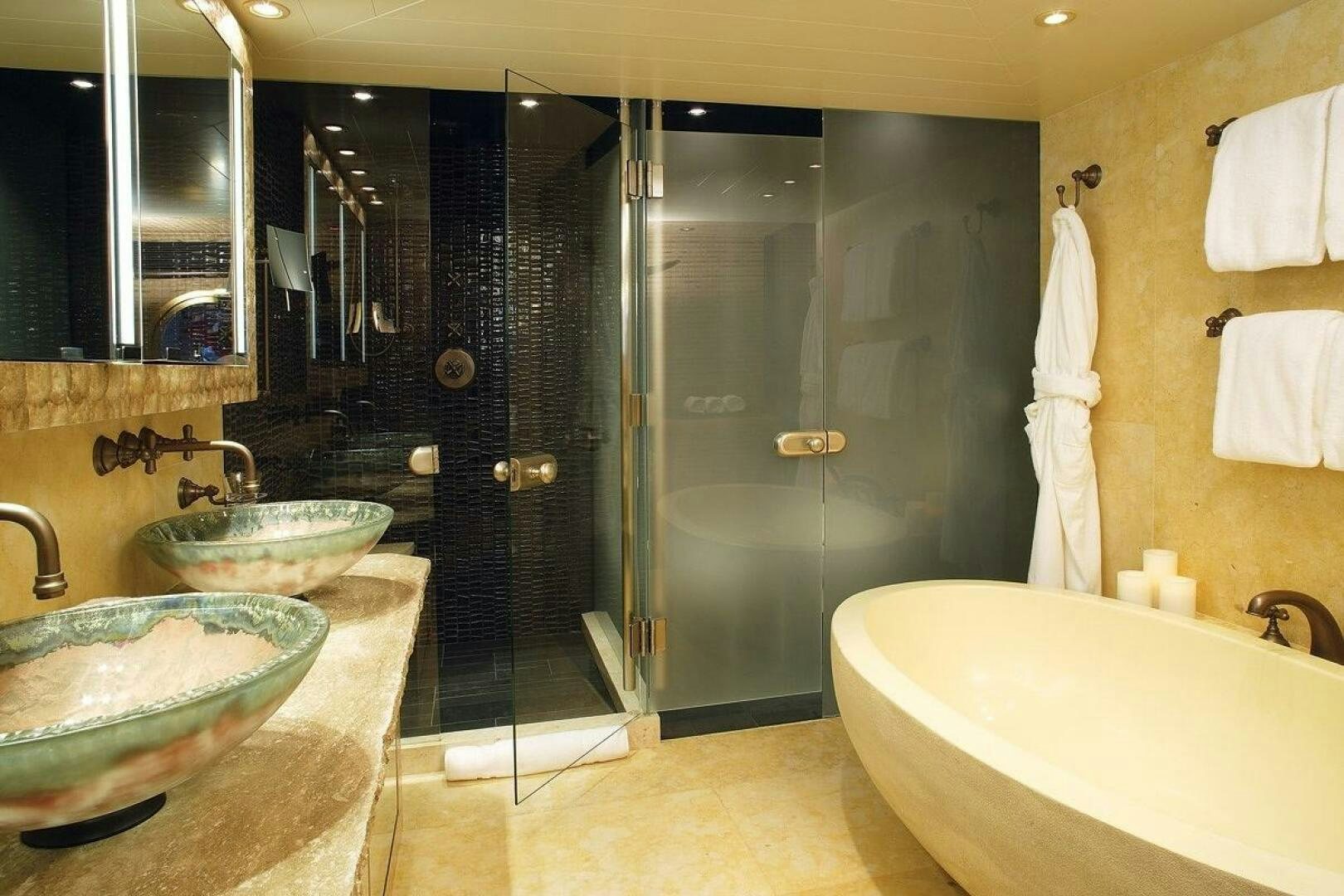a bathroom with a glass shower aboard PERLE BLEUE Yacht for Sale
