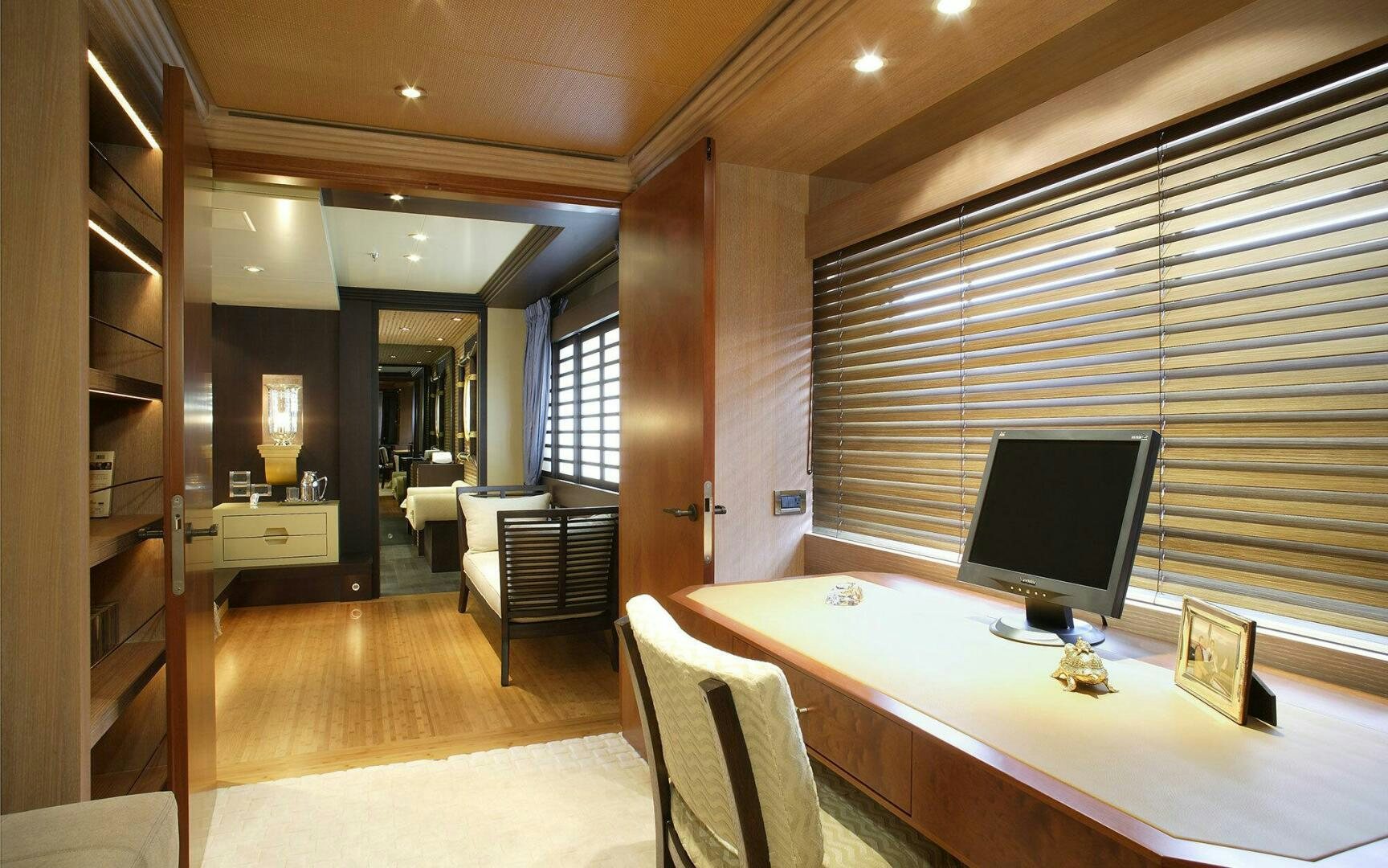 a room with a desk and a computer aboard PERLE BLEUE Yacht for Sale