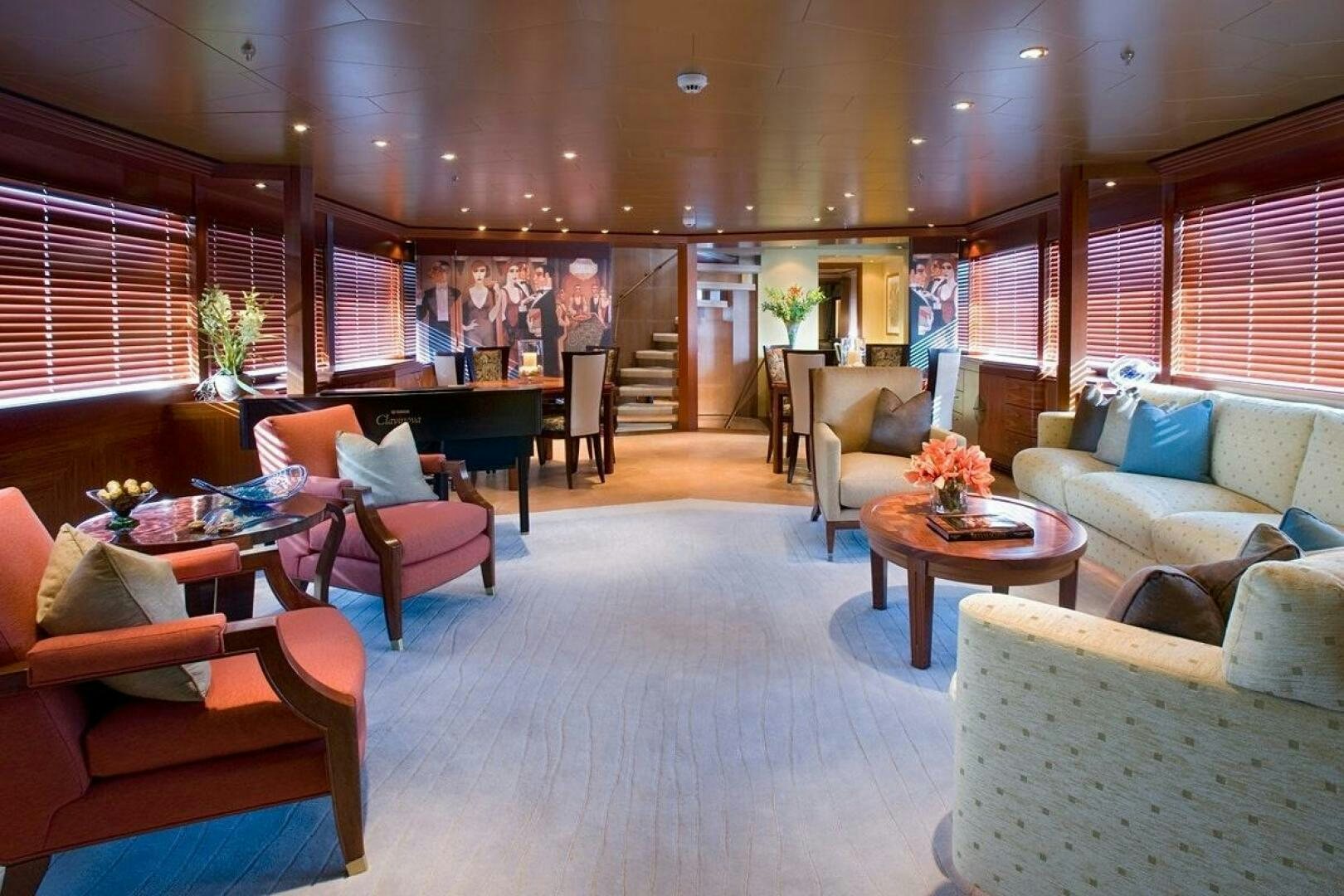 a living room with couches and a table aboard PERLE BLEUE Yacht for Sale