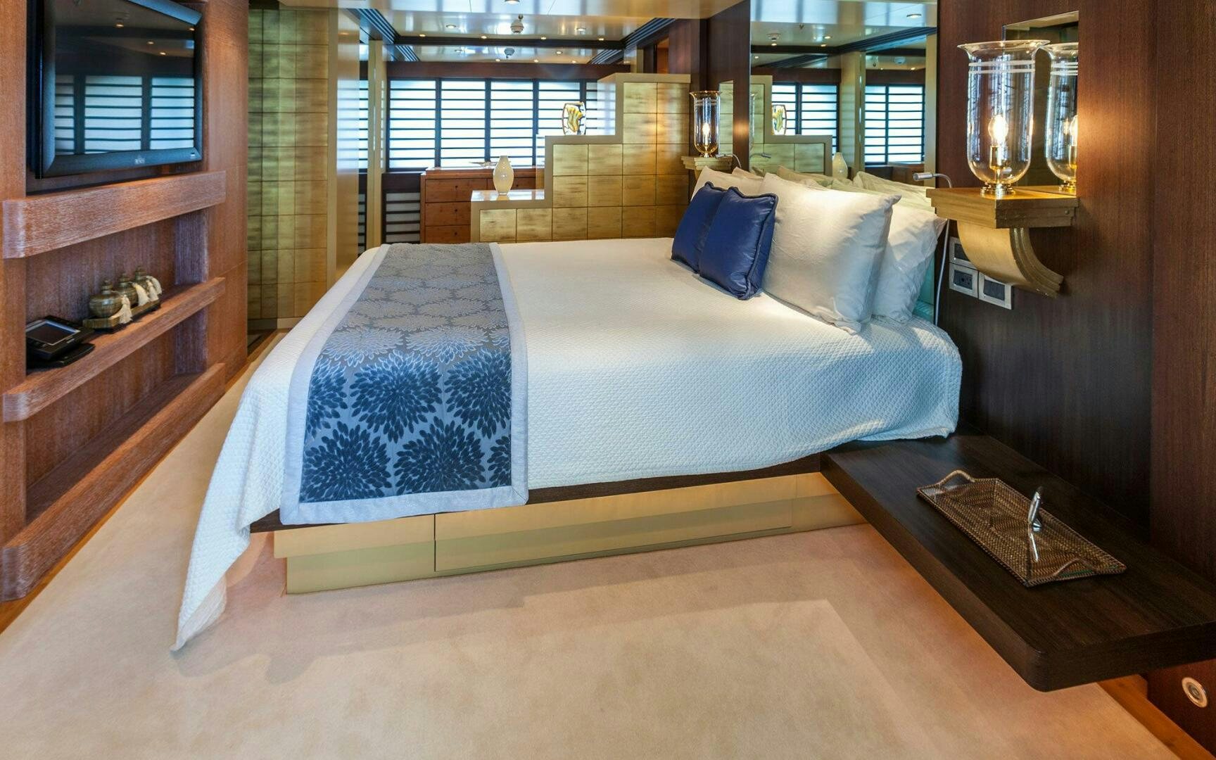 a bed in a room aboard PERLE BLEUE Yacht for Sale