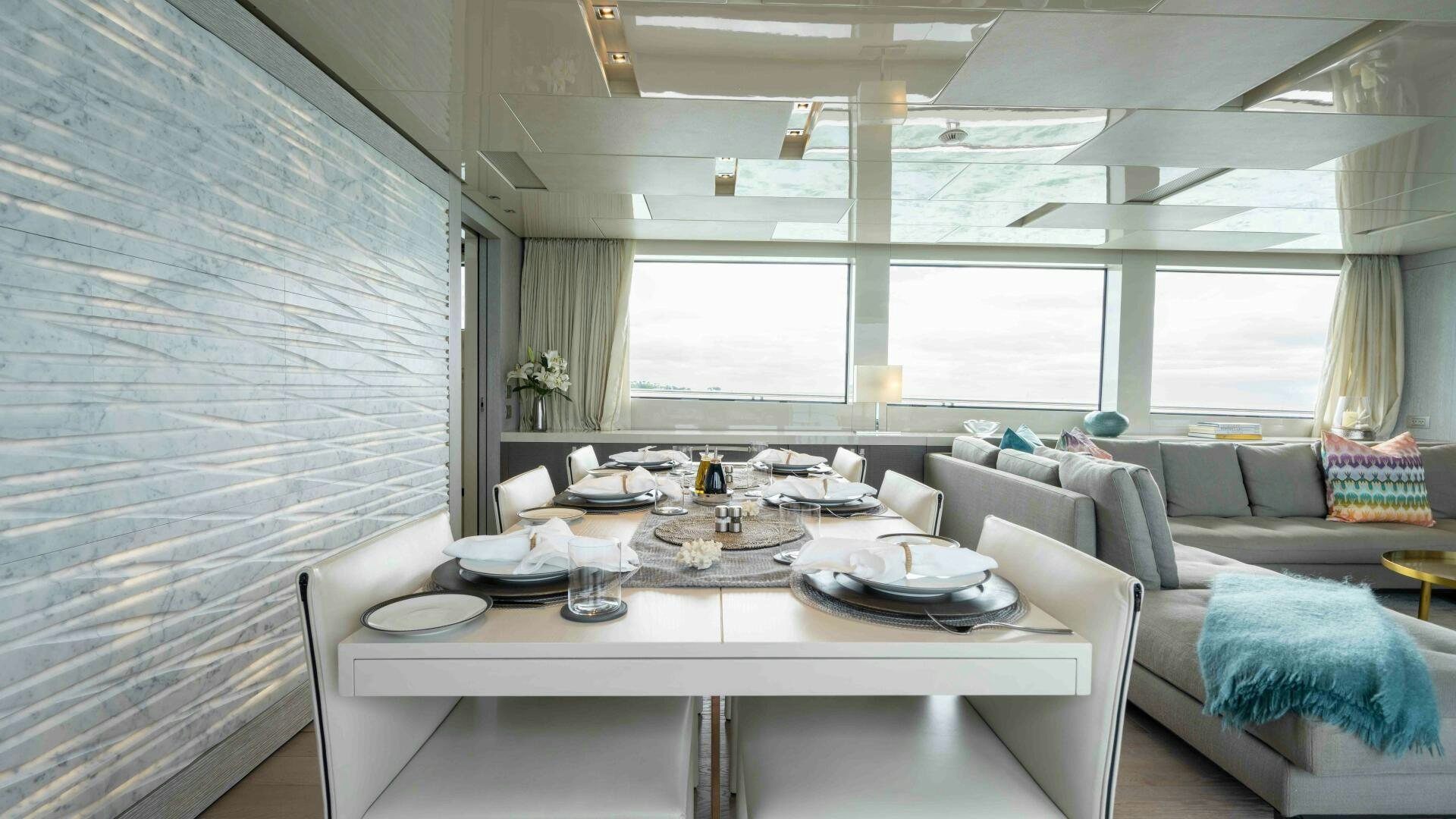 a large room with a table and chairs aboard HONEY POT Yacht for Sale