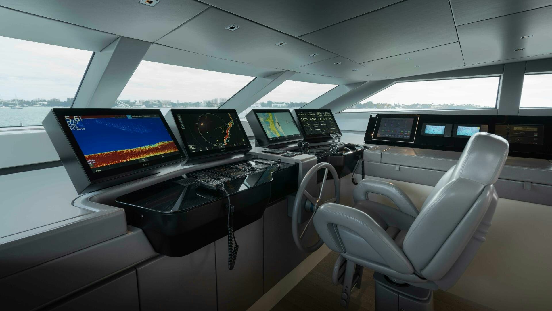 a room with computers and chairs aboard HONEY POT Yacht for Sale