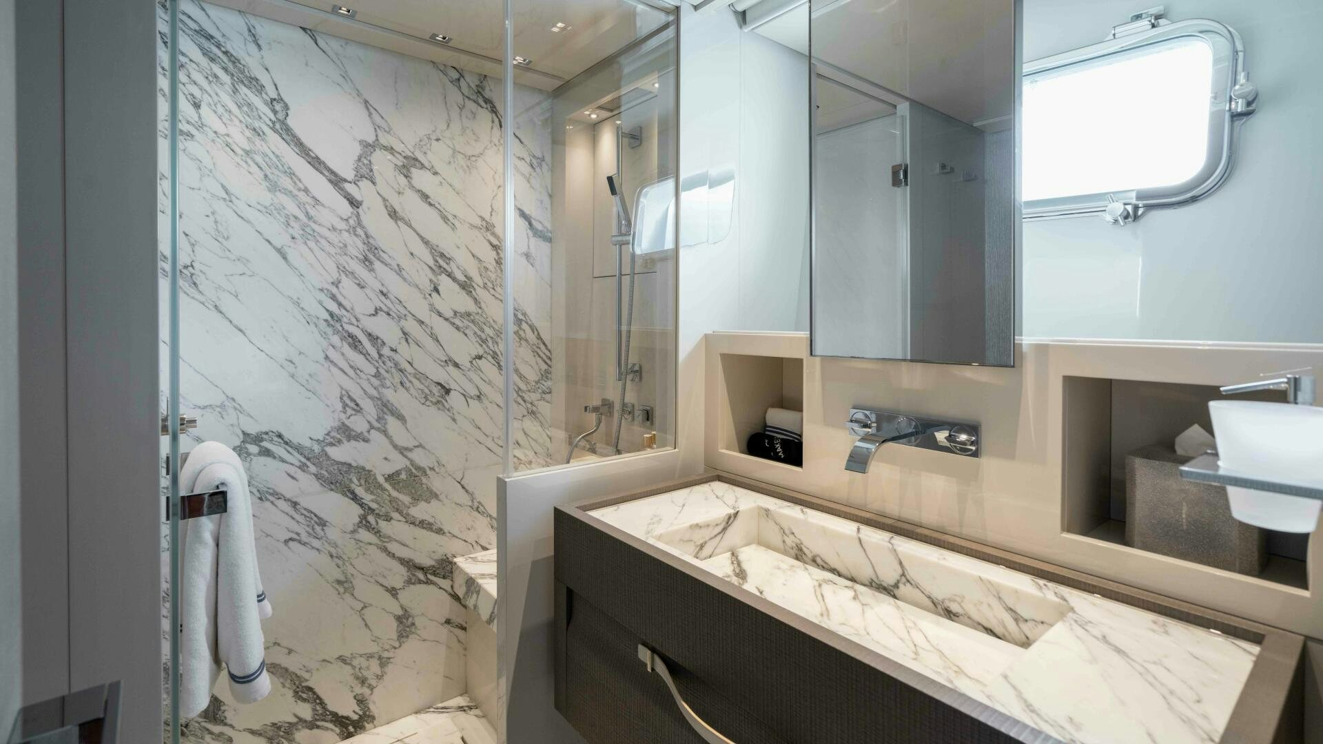 a bathroom with a large mirror aboard HONEY POT Yacht for Sale