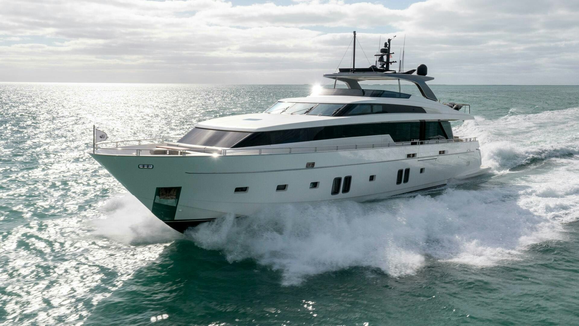 a white yacht on the water aboard HONEY POT Yacht for Sale