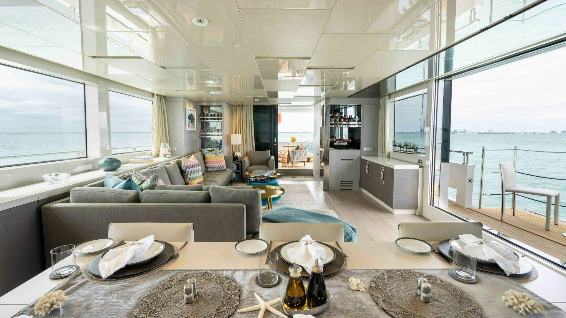 a living room with a couch and a table aboard HONEY POT Yacht for Sale