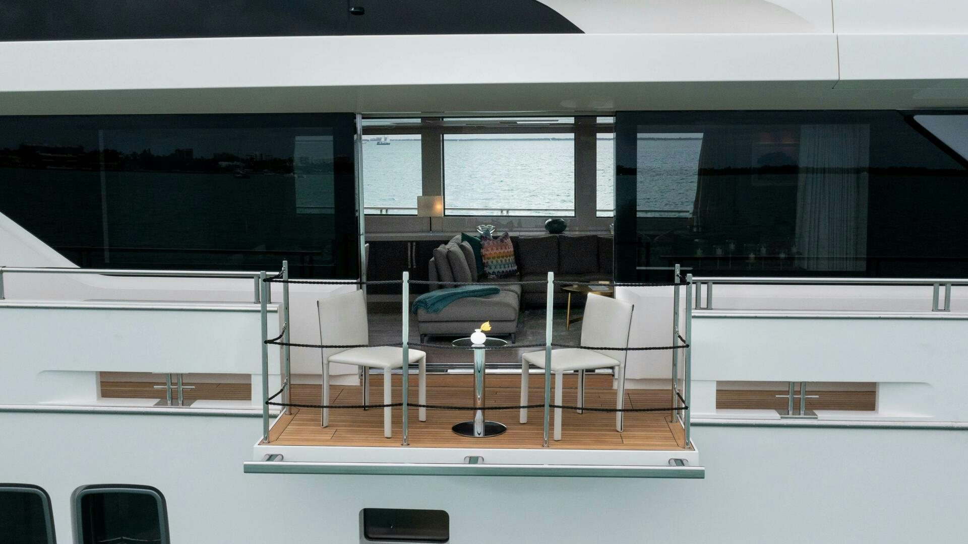 a room with chairs and a table aboard HONEY POT Yacht for Sale