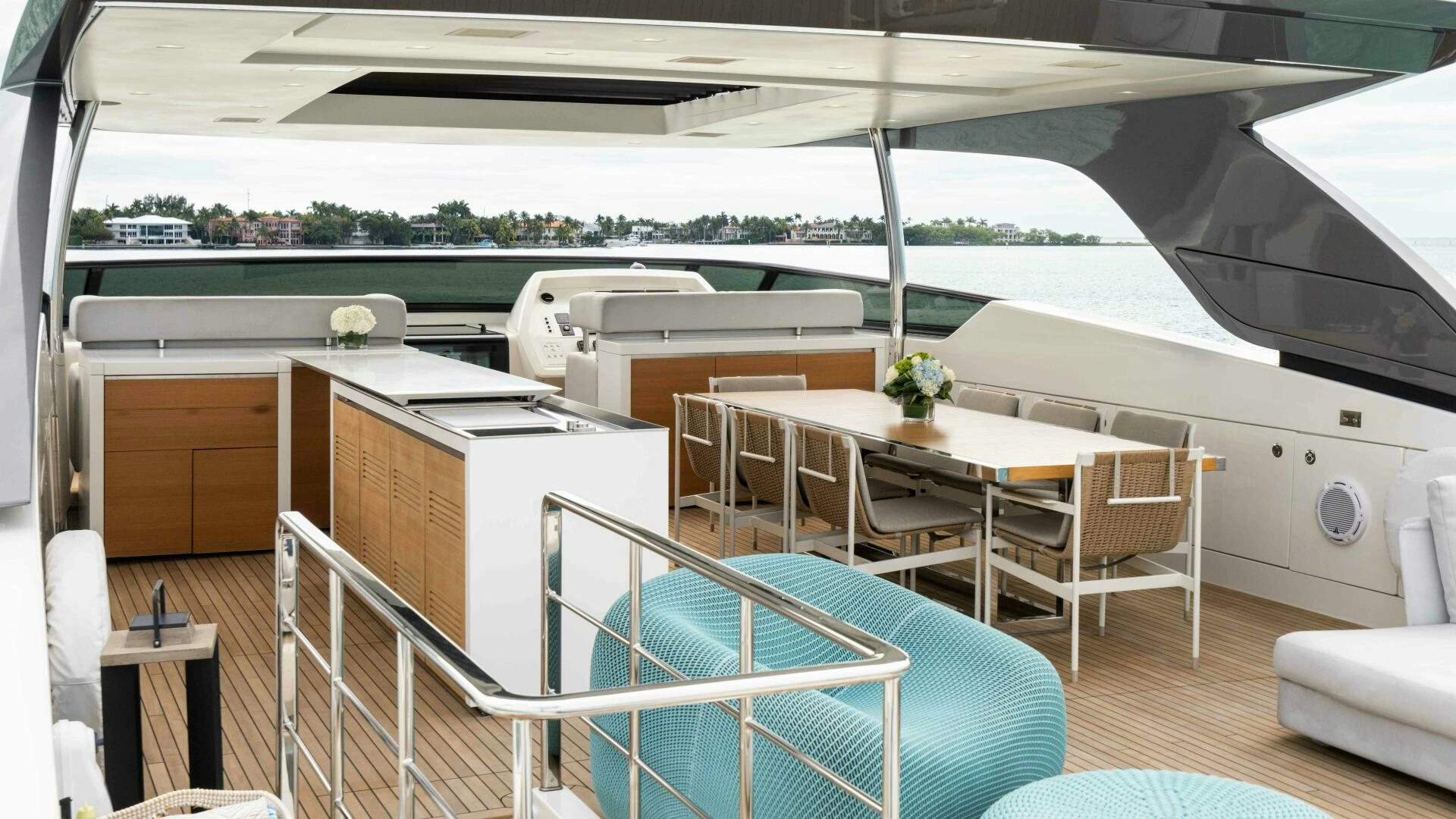 a large white and blue house with a pool table and chairs aboard HONEY POT Yacht for Sale