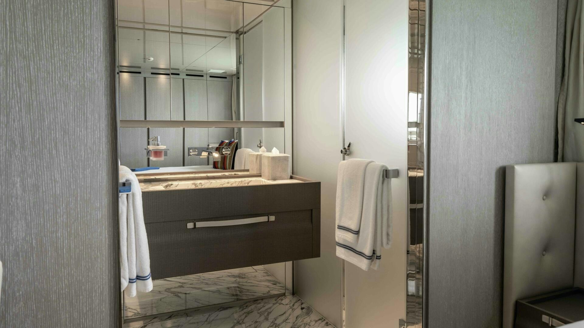 a bathroom with a sink and a mirror aboard HONEY POT Yacht for Sale