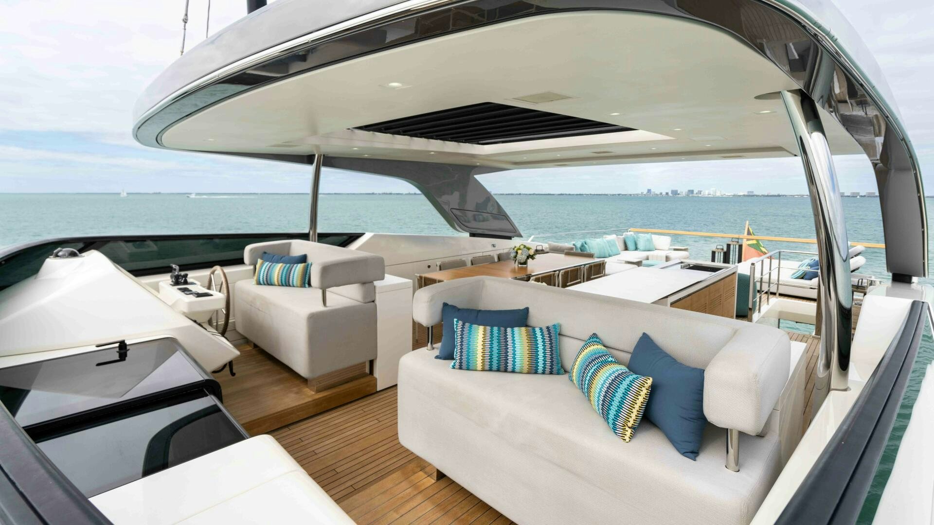 a room with a view of the ocean and the deck aboard HONEY POT Yacht for Sale
