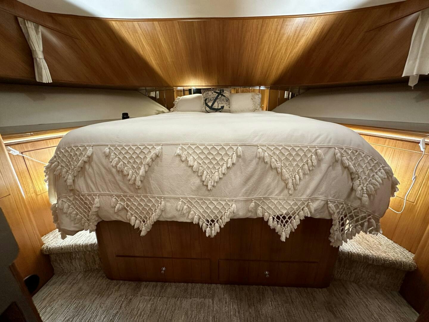 a bed with a white sheet aboard ALL ABORDEAUX Yacht for Sale