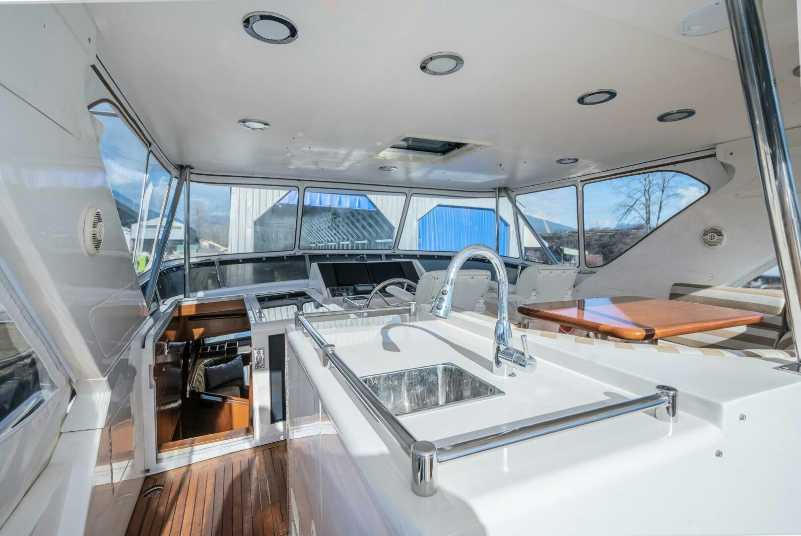 a white vehicle with a sink and a large window aboard ALL ABORDEAUX Yacht for Sale