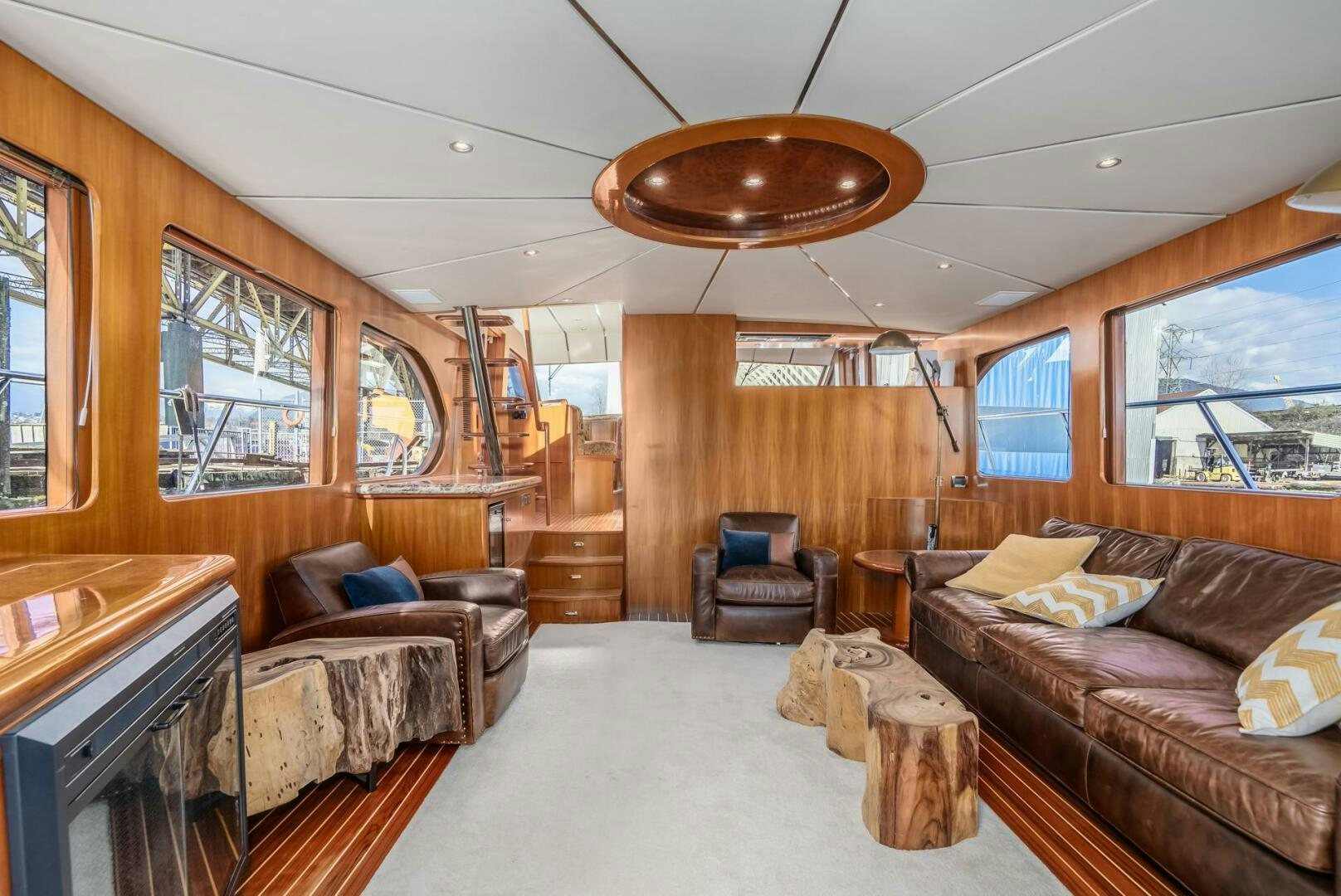 a living room with a couch and a fireplace aboard ALL ABORDEAUX Yacht for Sale