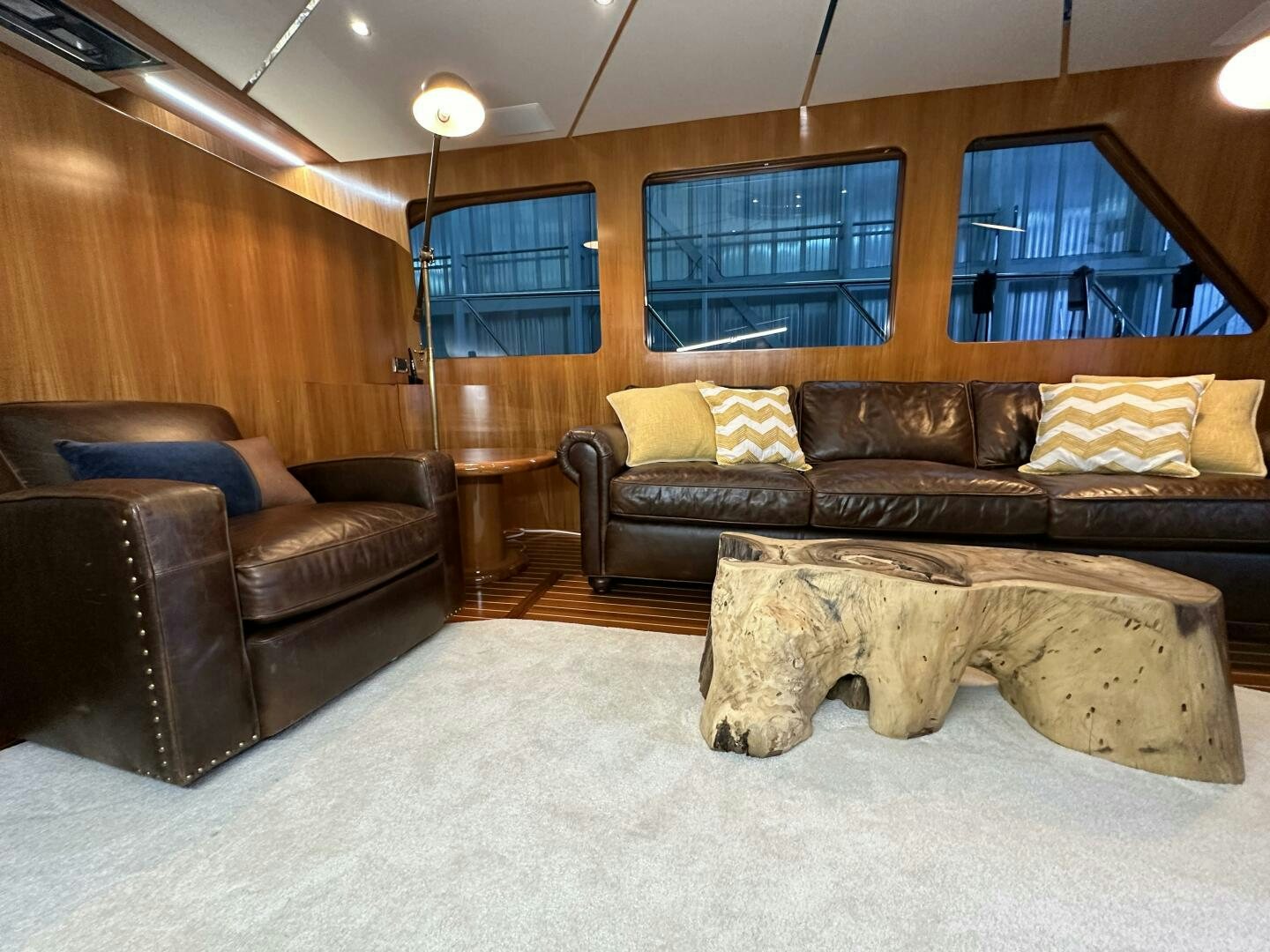 a living room with leather couches aboard ALL ABORDEAUX Yacht for Sale