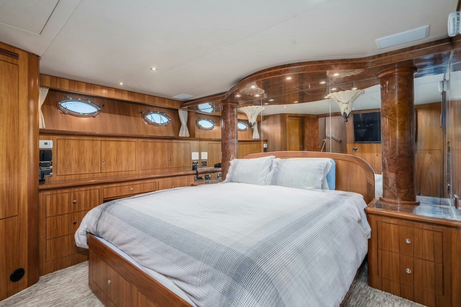 a bedroom with a bed and a wood wall aboard ALL ABORDEAUX Yacht for Sale