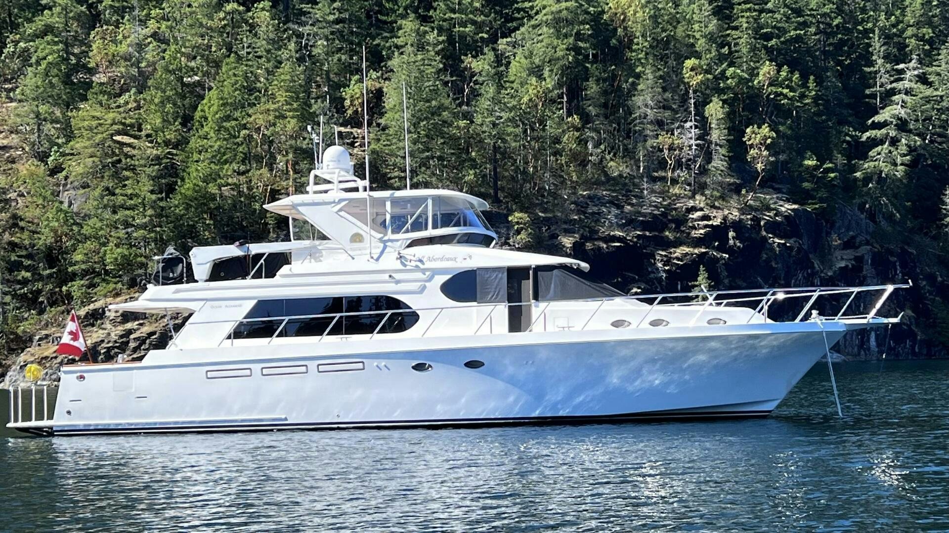 a white yacht in the water aboard ALL ABORDEAUX Yacht for Sale