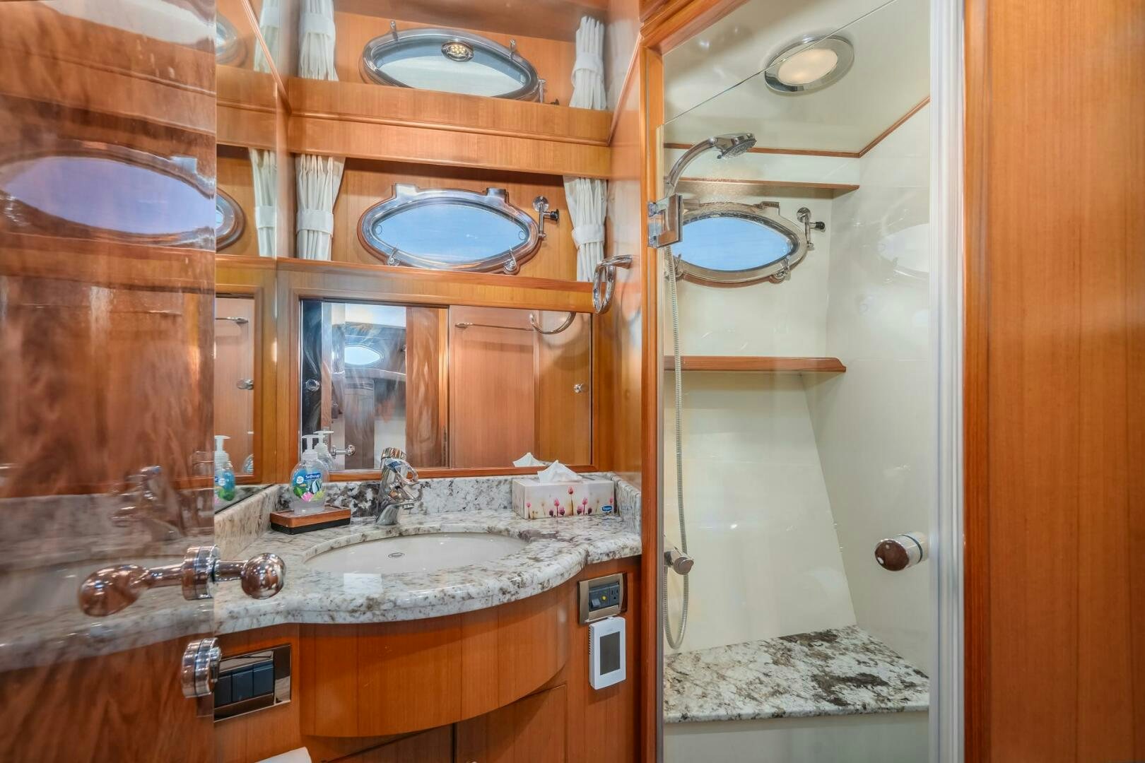 a bathroom with a large mirror aboard ALL ABORDEAUX Yacht for Sale