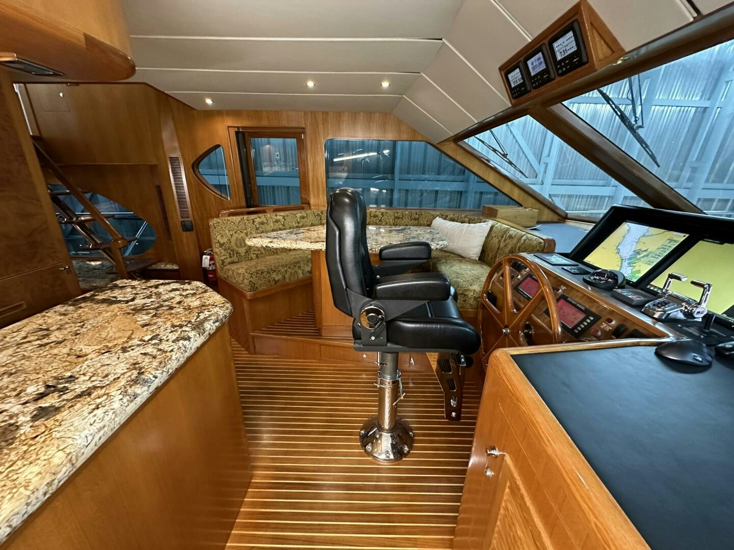 a room with a couch and a desk aboard ALL ABORDEAUX Yacht for Sale