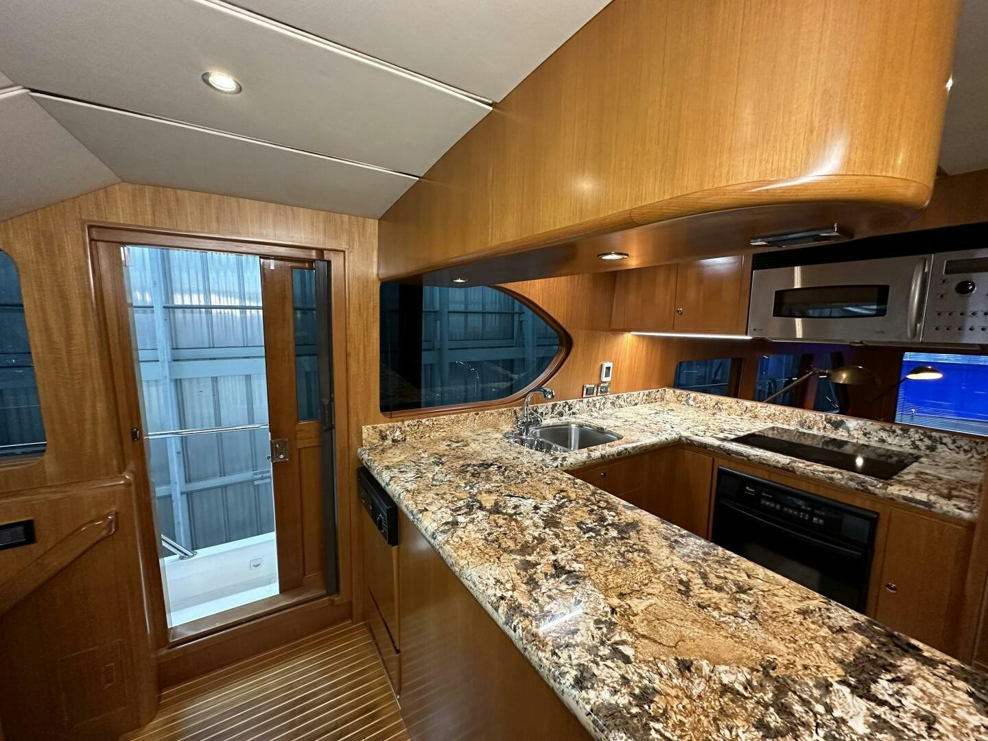 a kitchen with a marble counter top aboard ALL ABORDEAUX Yacht for Sale