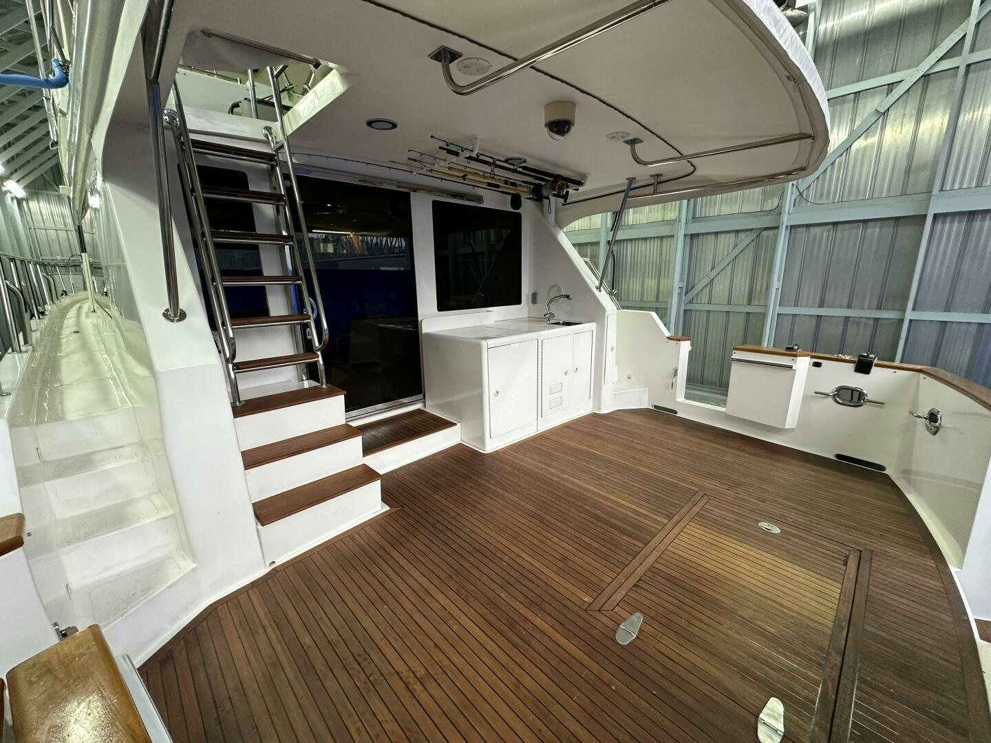 a room with a wood floor and a staircase aboard ALL ABORDEAUX Yacht for Sale