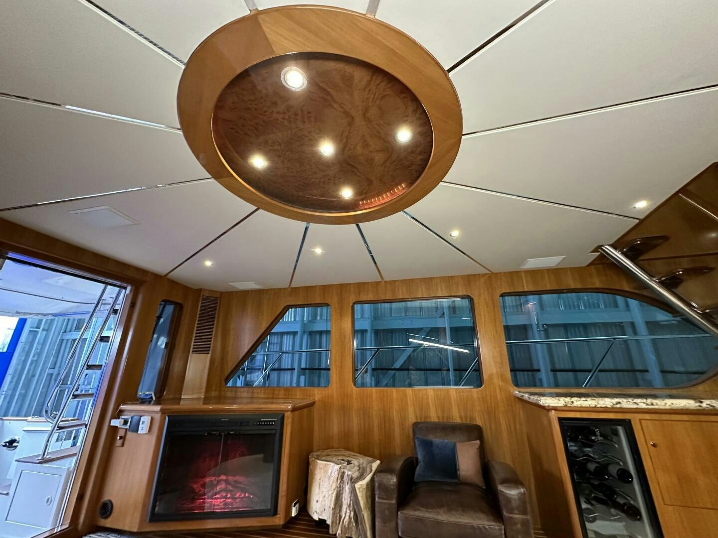 a room with a fireplace and a mirror aboard ALL ABORDEAUX Yacht for Sale