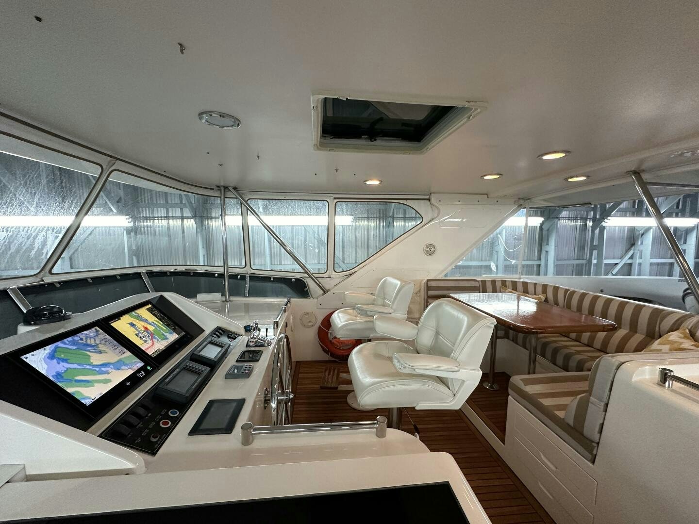 inside of a building with a large window and a large open window aboard ALL ABORDEAUX Yacht for Sale