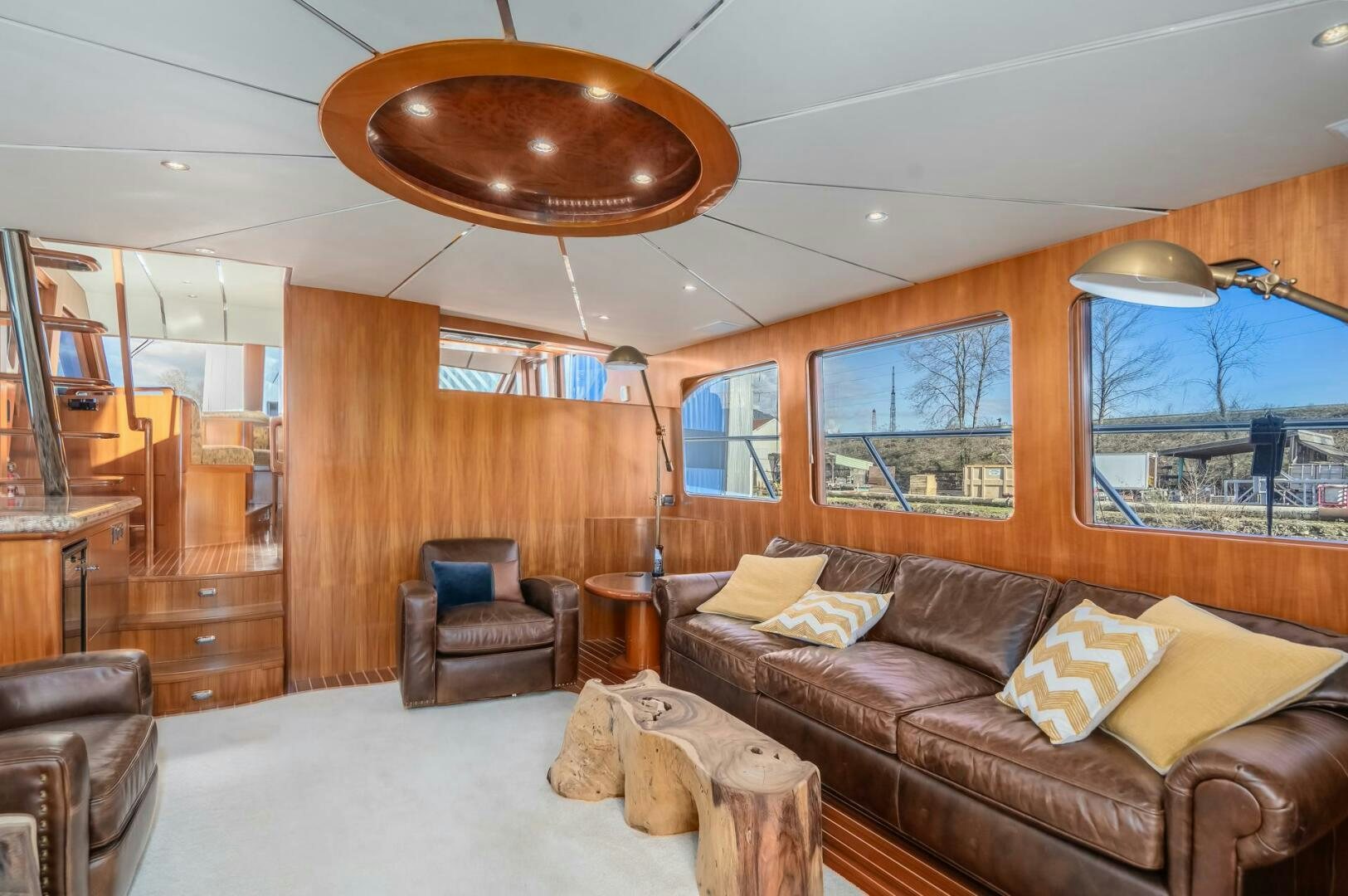 a living room with a large window aboard ALL ABORDEAUX Yacht for Sale