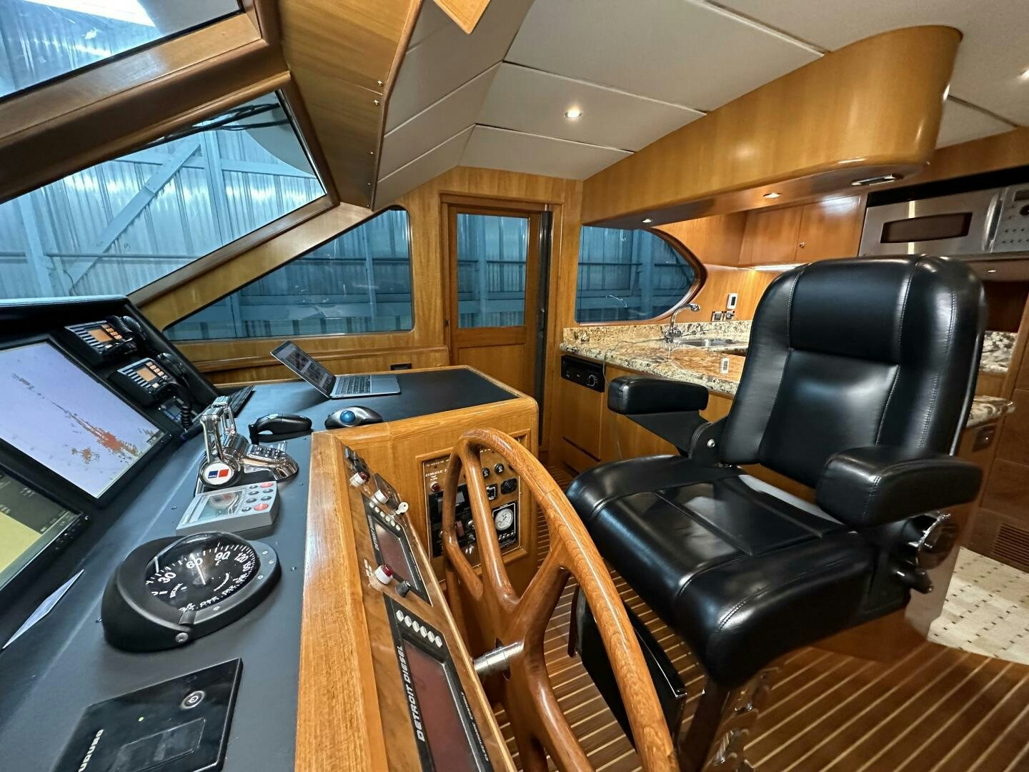 a room with a leather chair and a desk with a computer aboard ALL ABORDEAUX Yacht for Sale