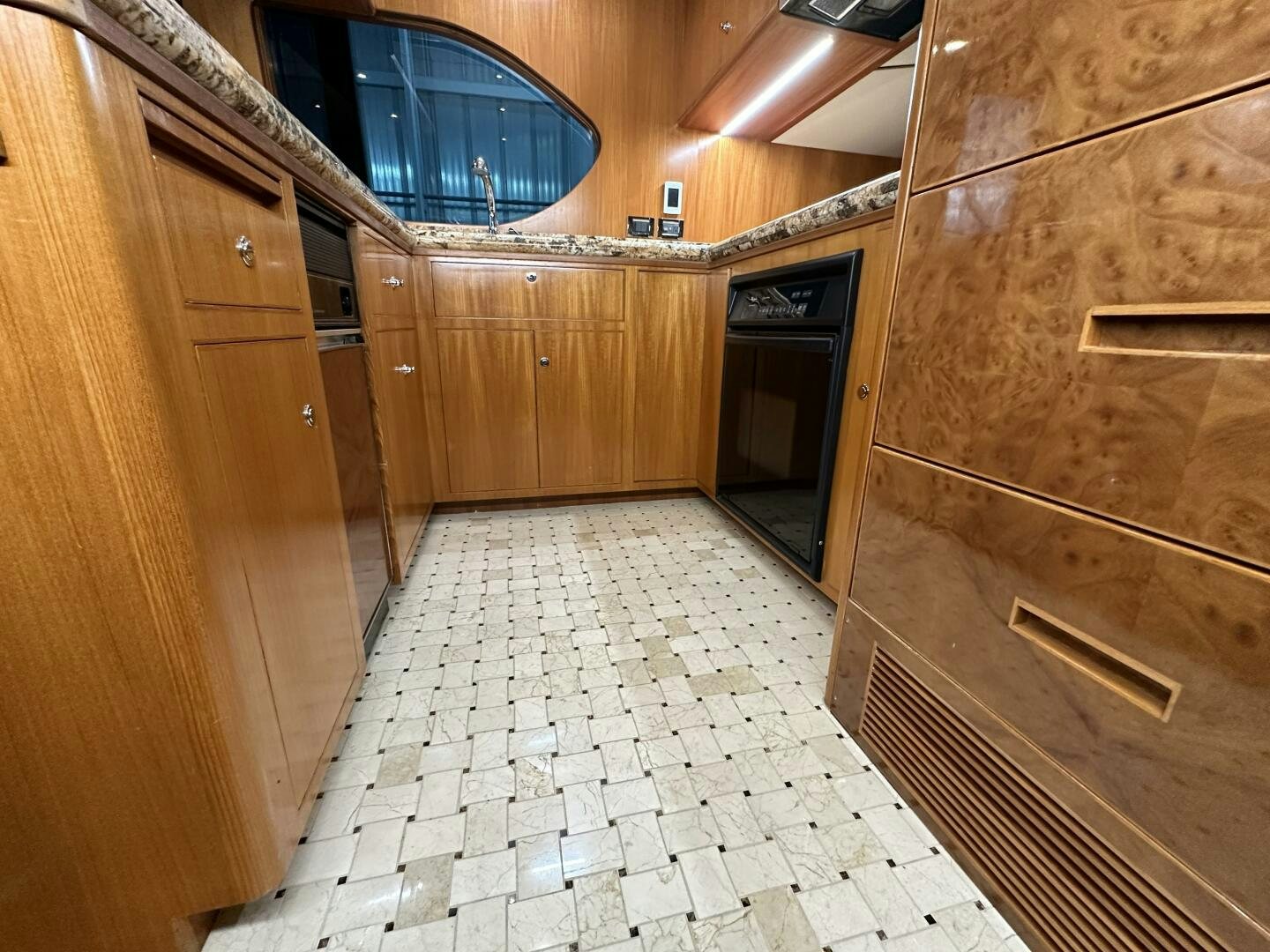a bathroom with wooden cabinets aboard ALL ABORDEAUX Yacht for Sale