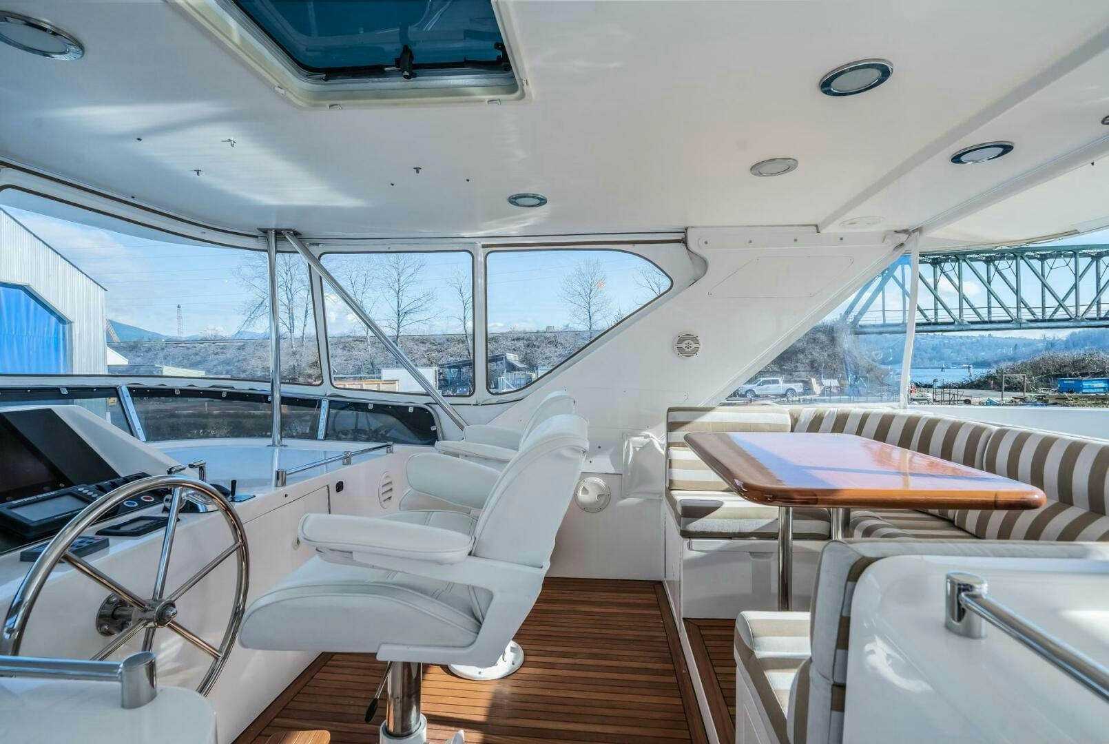 a boat with a deck and chairs aboard ALL ABORDEAUX Yacht for Sale