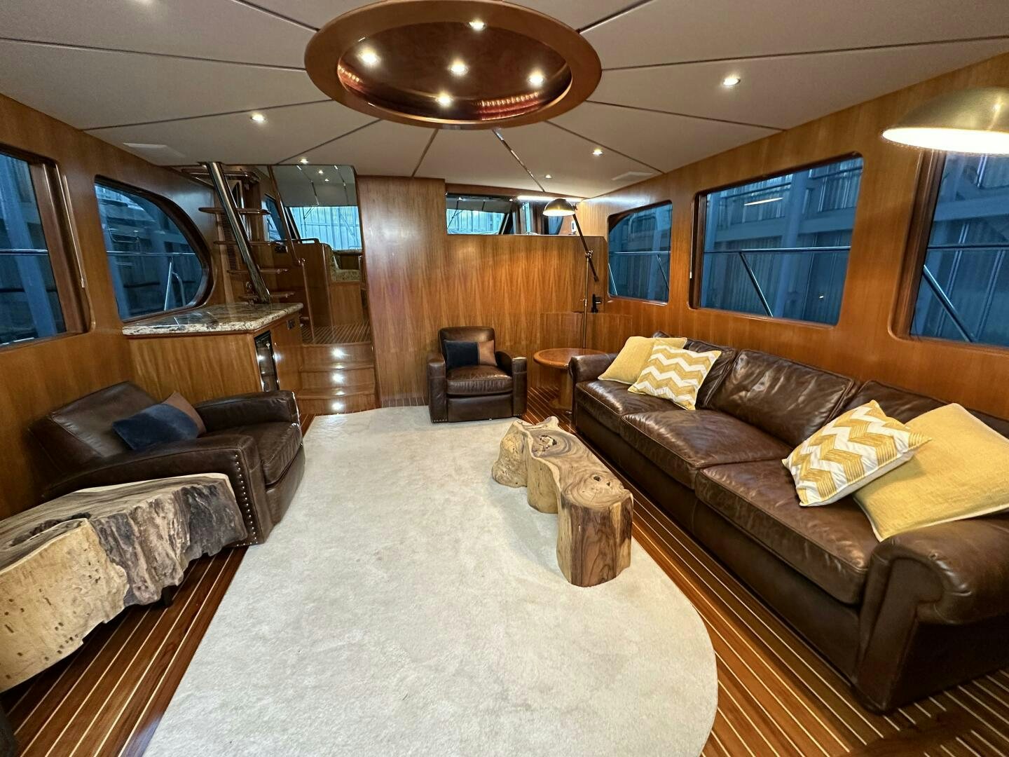 a living room with leather couches aboard ALL ABORDEAUX Yacht for Sale