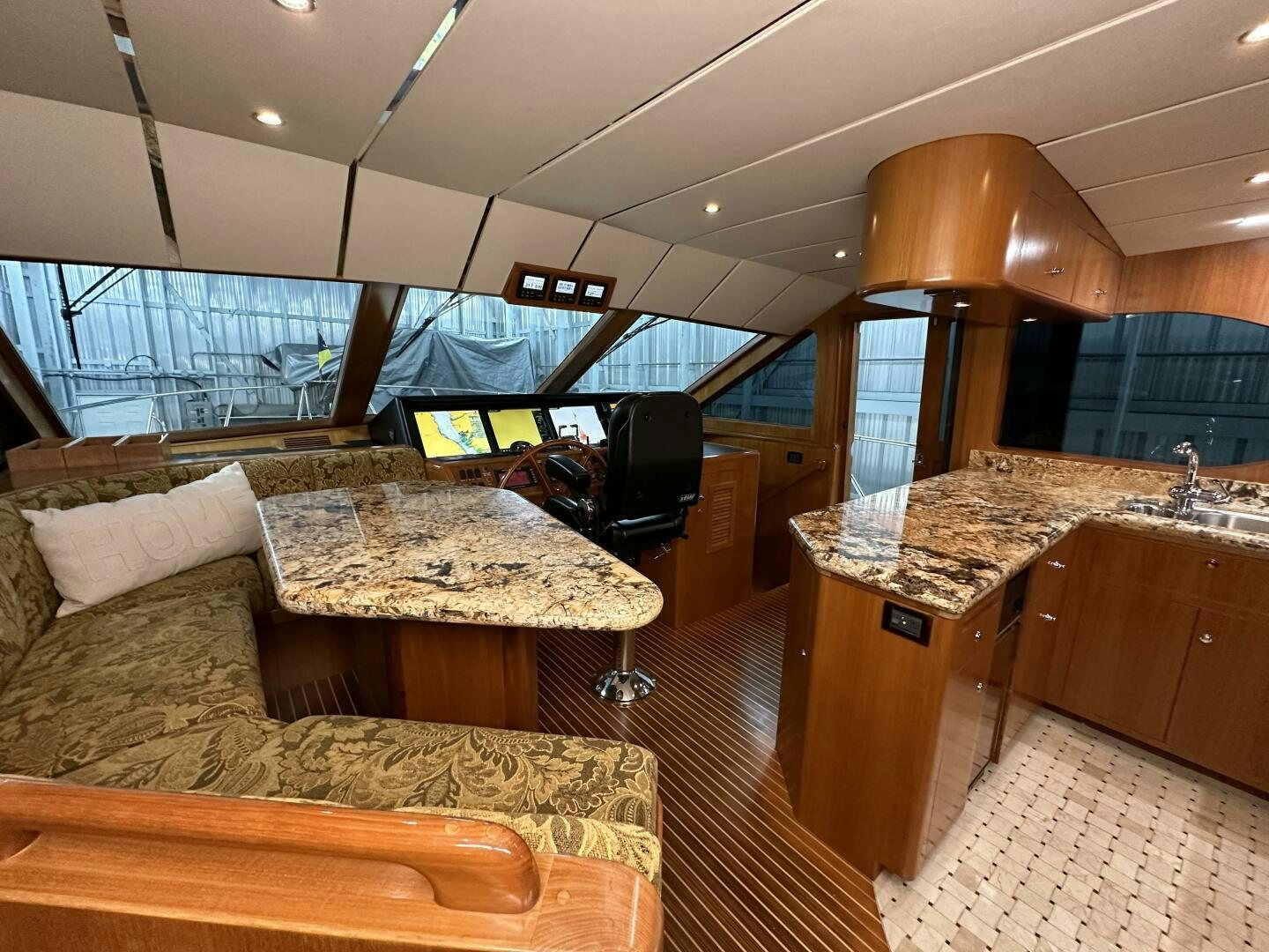 a room with a couch and a table aboard ALL ABORDEAUX Yacht for Sale