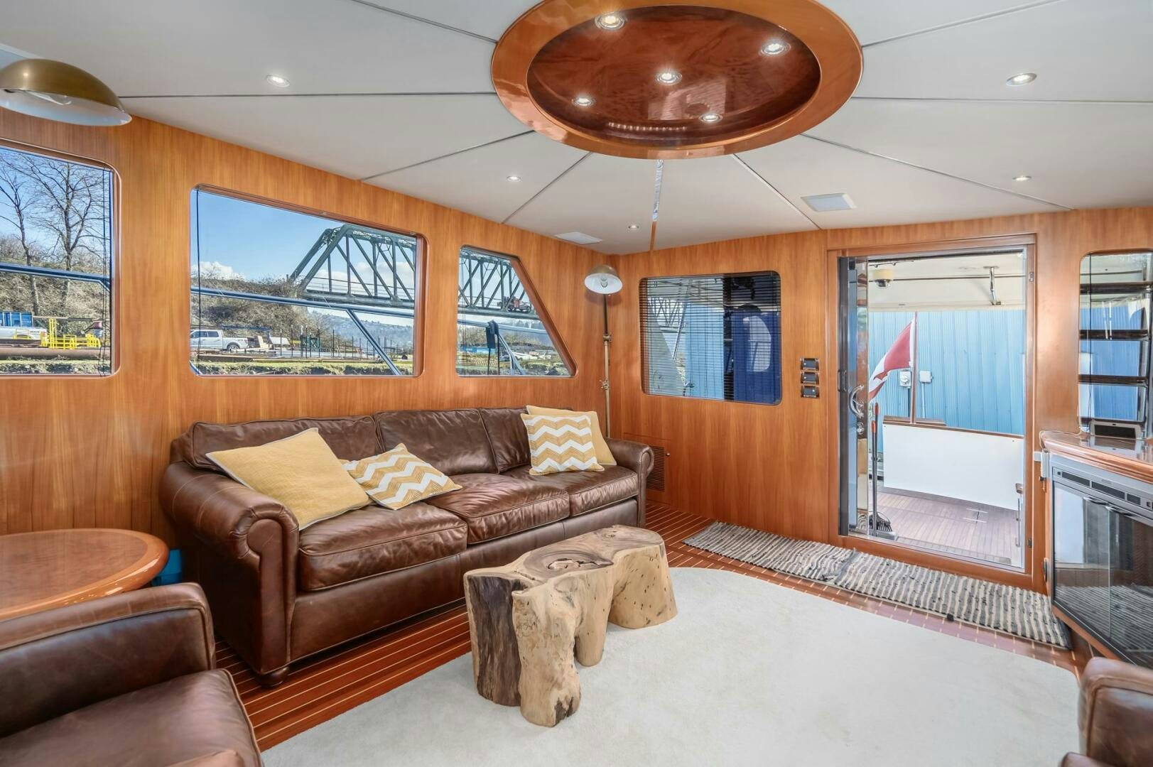 a living room with a leather couch aboard ALL ABORDEAUX Yacht for Sale