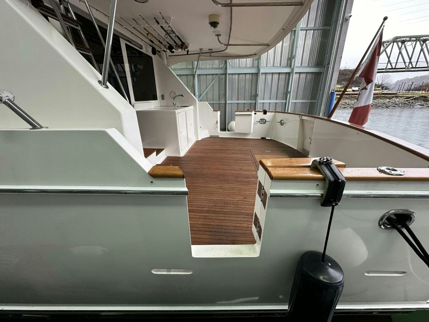 a large white staircase with a flag on the top aboard ALL ABORDEAUX Yacht for Sale