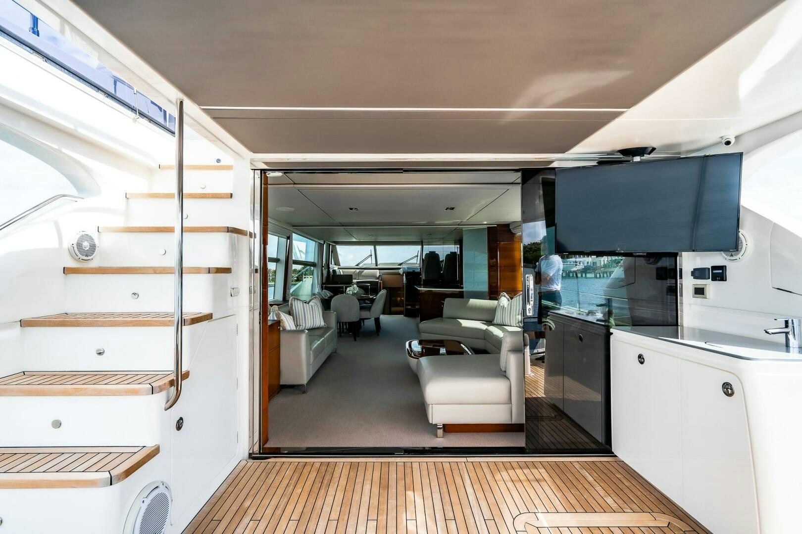 a room with a wood floor and a large open door aboard PERFECT MATCH Yacht for Sale