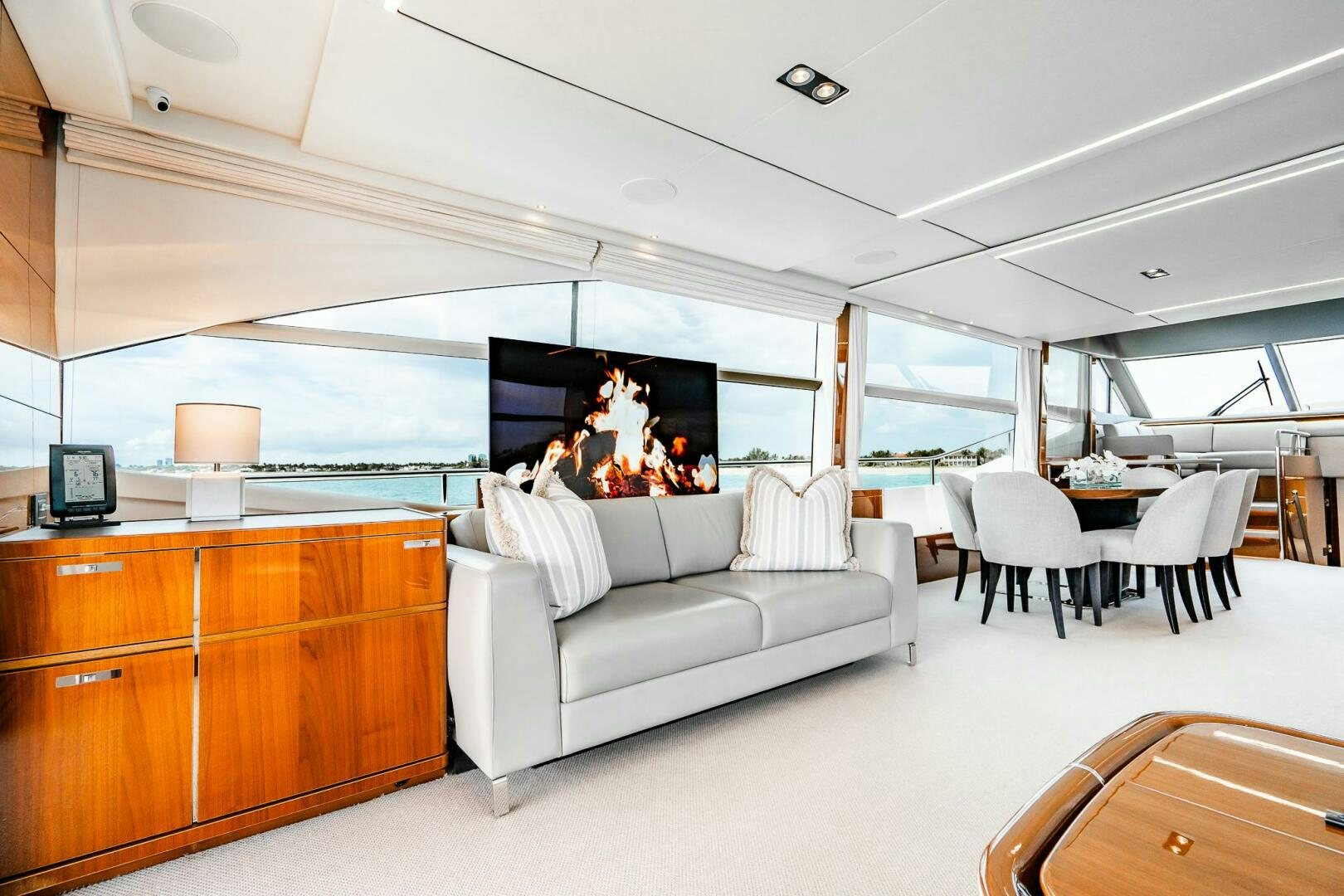 a living room with a large screen aboard PERFECT MATCH Yacht for Sale