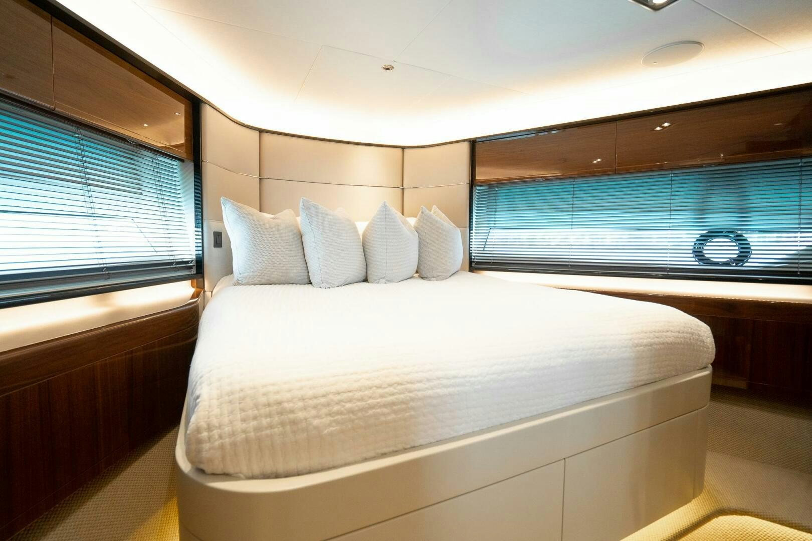 a bed with a large window aboard PERFECT MATCH Yacht for Sale