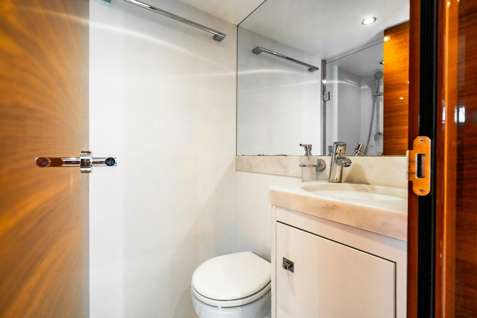 a bathroom with a toilet and a sink aboard PERFECT MATCH Yacht for Sale