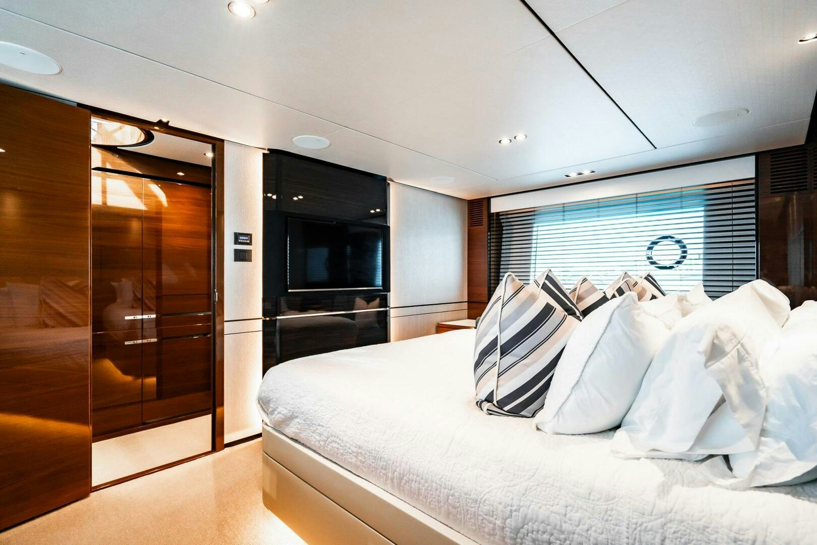 a room with a bed and a closet aboard PERFECT MATCH Yacht for Sale