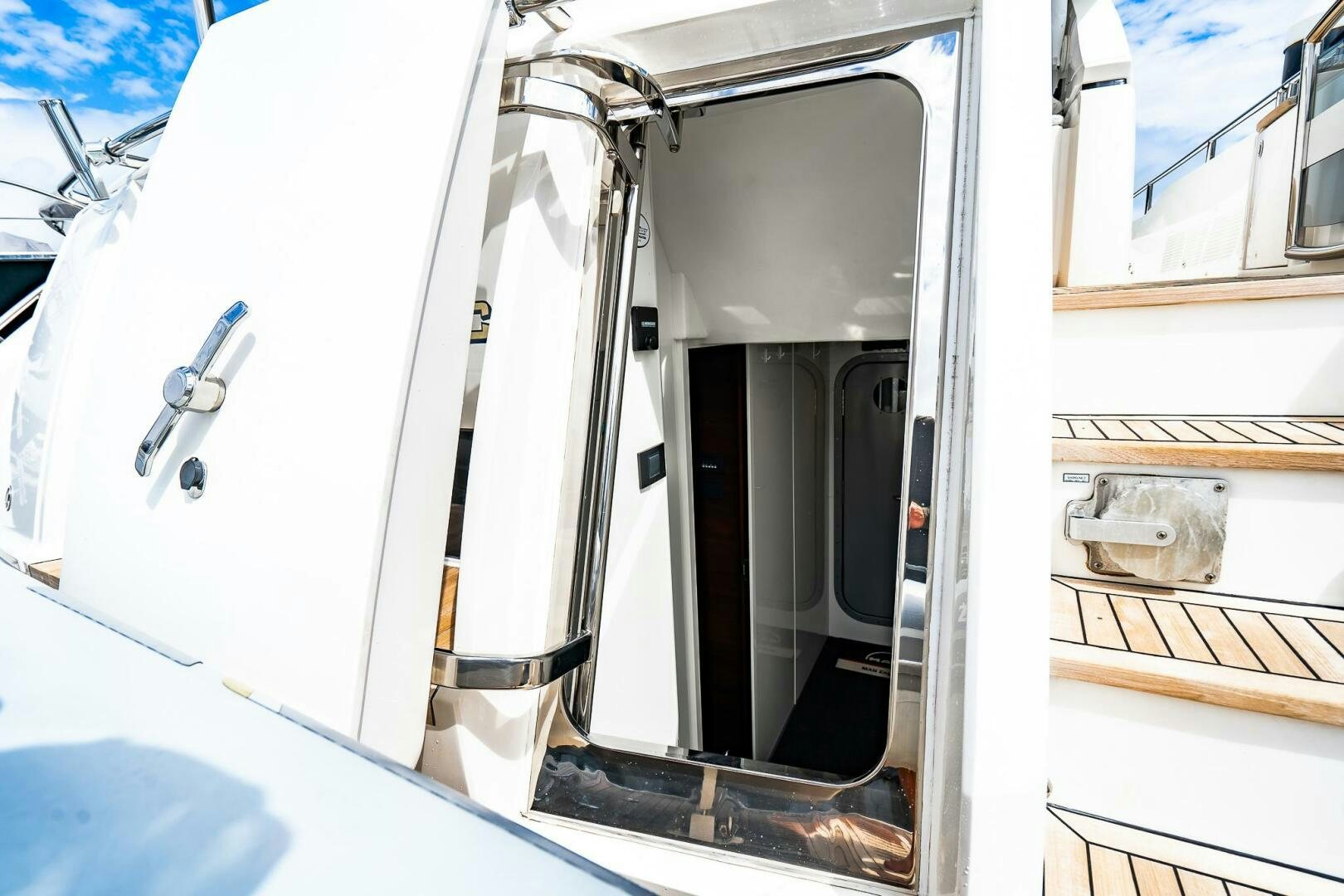 a white vehicle with a black door aboard PERFECT MATCH Yacht for Sale