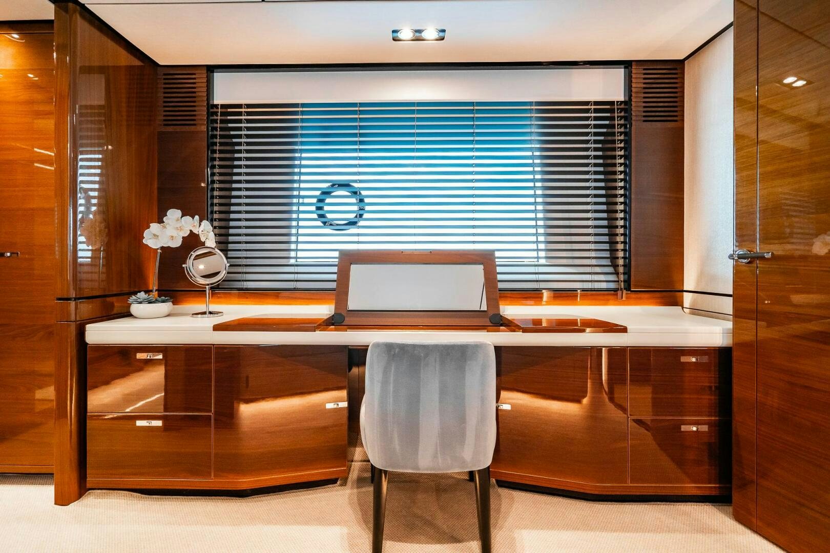 a desk with a laptop on it aboard PERFECT MATCH Yacht for Sale
